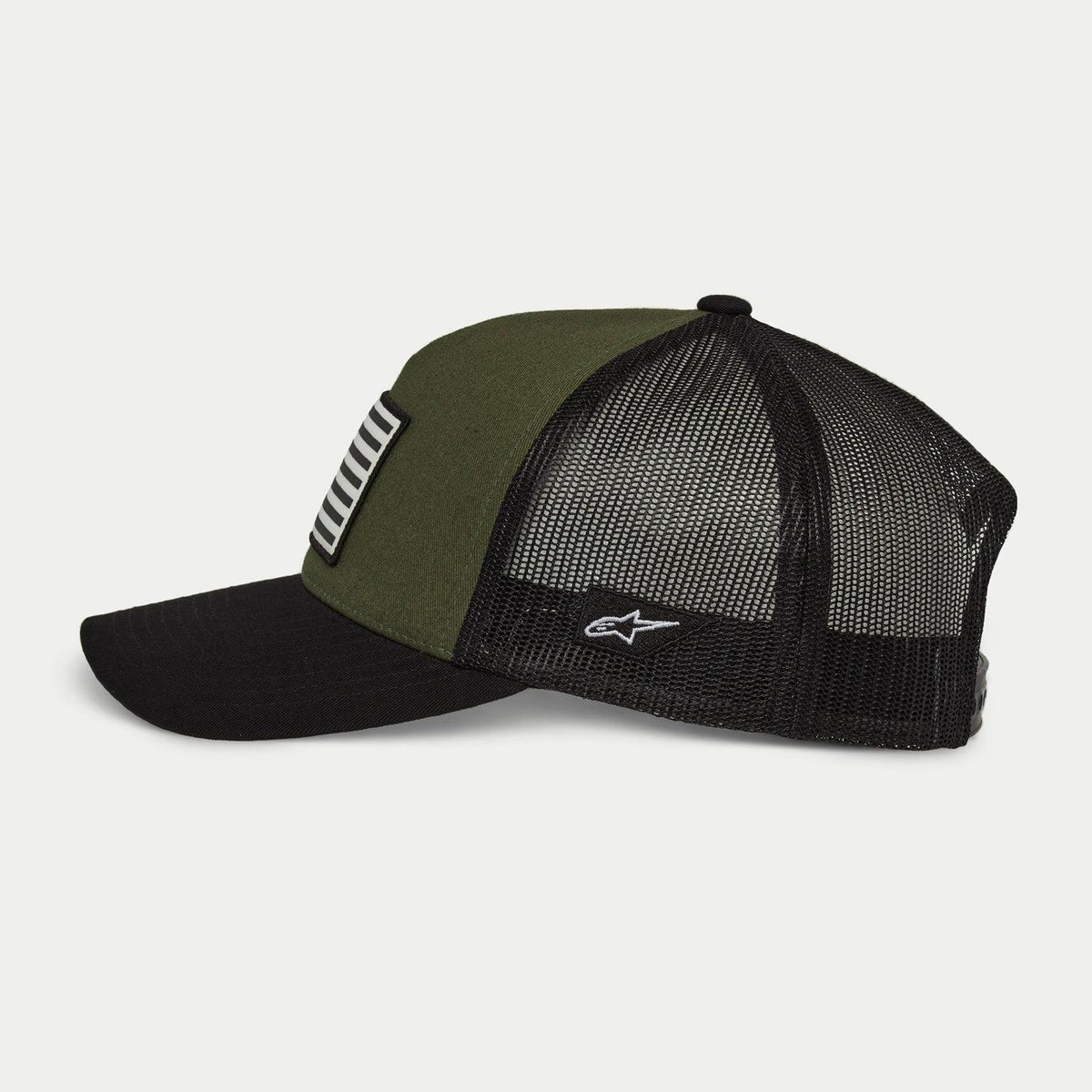Alpinestars Flag Snapback Hat in Military Black, side profile view, olive green front panel with black curved bill and black mesh back, white embroidered logo on the side, casual motorsport-inspired headwear