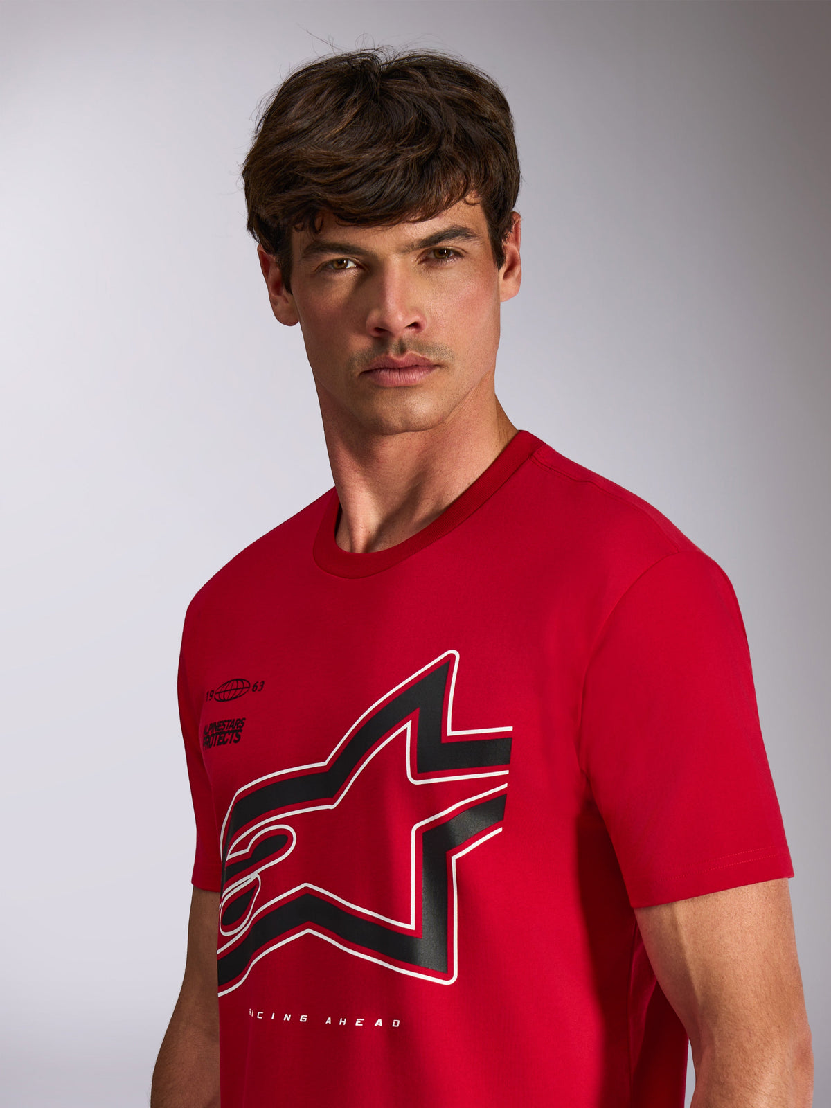Alpinestars Authority CSF Tee, Short Sleeve T-Shirt, Red, Large Cropped Black and White Astars Logo with Outline, worn by model, casual motorsport-inspired streetwear