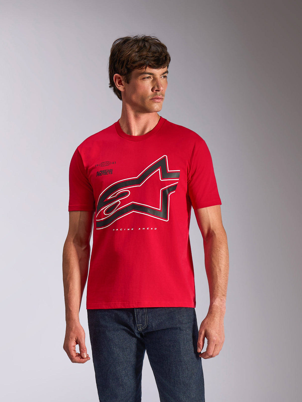 Alpinestars Authority CSF Tee, Short Sleeve T-Shirt, Red, large black and white outlined Astars logo on chest, worn by a male model with dark blue jeans, casual motorsport-inspired streetwear
