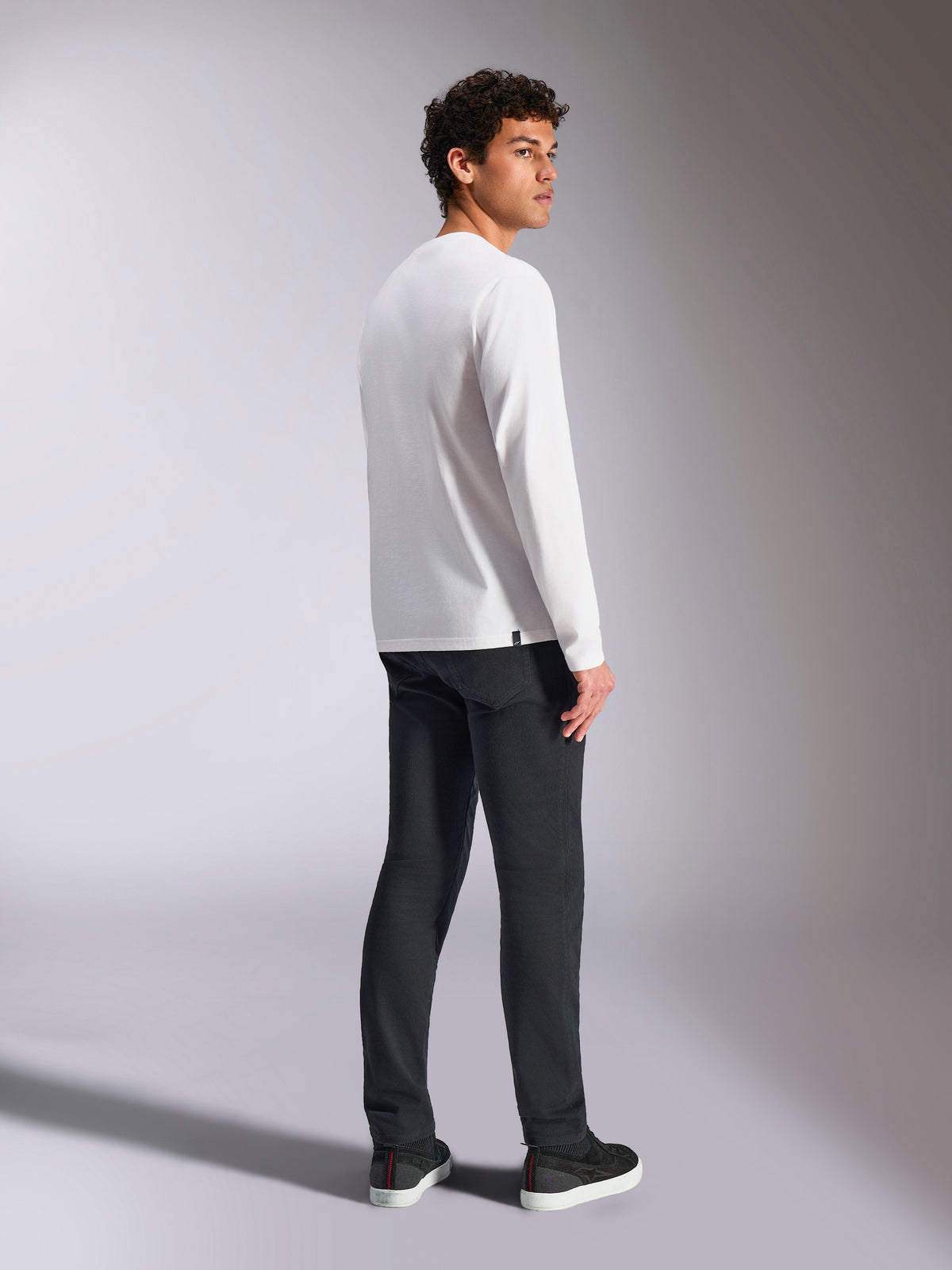 Alpinestars Trackside CSF Tee, Long Sleeve T-Shirt, White, male model viewed from the back wearing black pants, casual motorsport-inspired streetwear