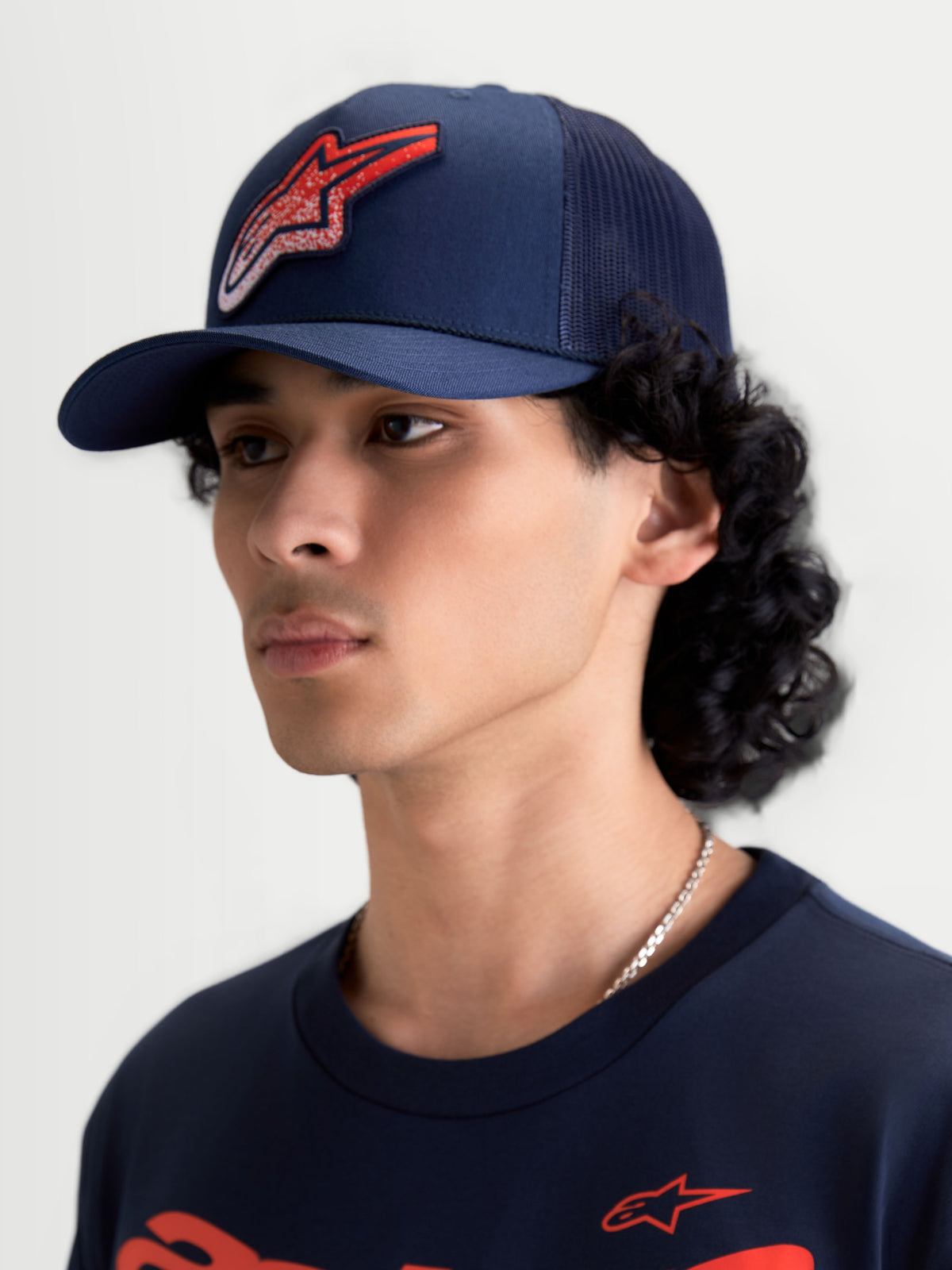 Alpinestars Meteorite Trucker Hat, Sportswear Mesh Cap, Navy Blue with Red Astars Gravel-Texture Logo, Curved Bill and Structured Crown, On-Model View