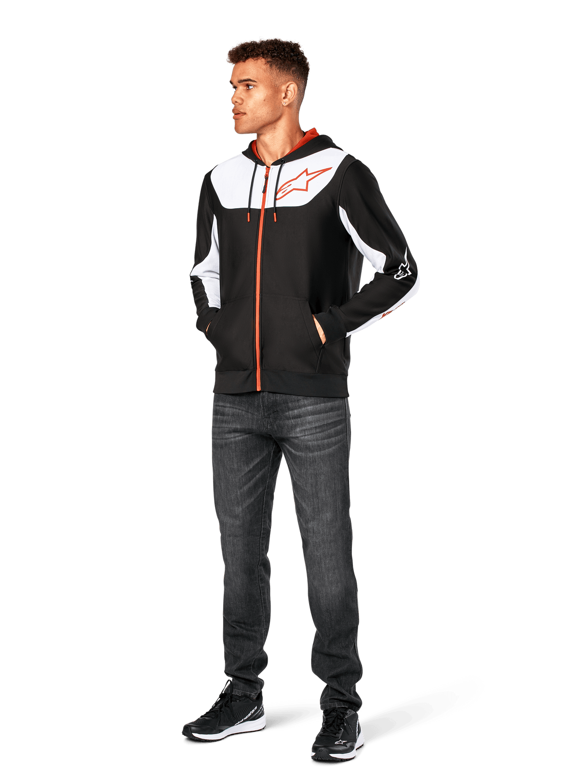 Alpinestars Sessions V3 Hoodie, casual zip-front hoodie, Black White and Red, worn by model with dark jeans and black sneakers, featuring white color-block panels on the chest and sleeves, red zipper and drawcord details, large chest logo, poly fleece motorsport-inspired streetwear