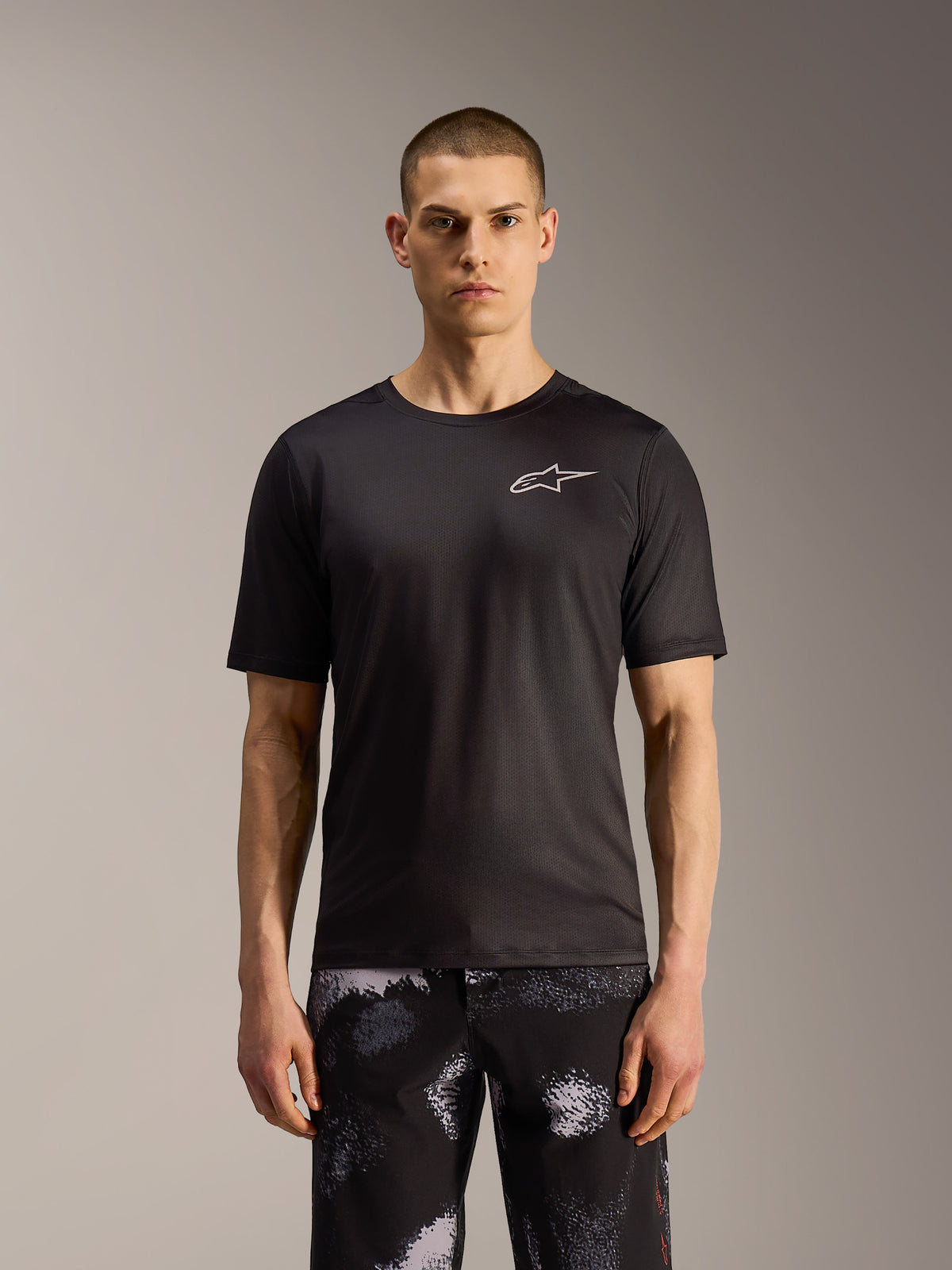 A-Dura Ride Shorts in Black Camo, durable MTB shorts featuring a rugged pattern, shown on a model.