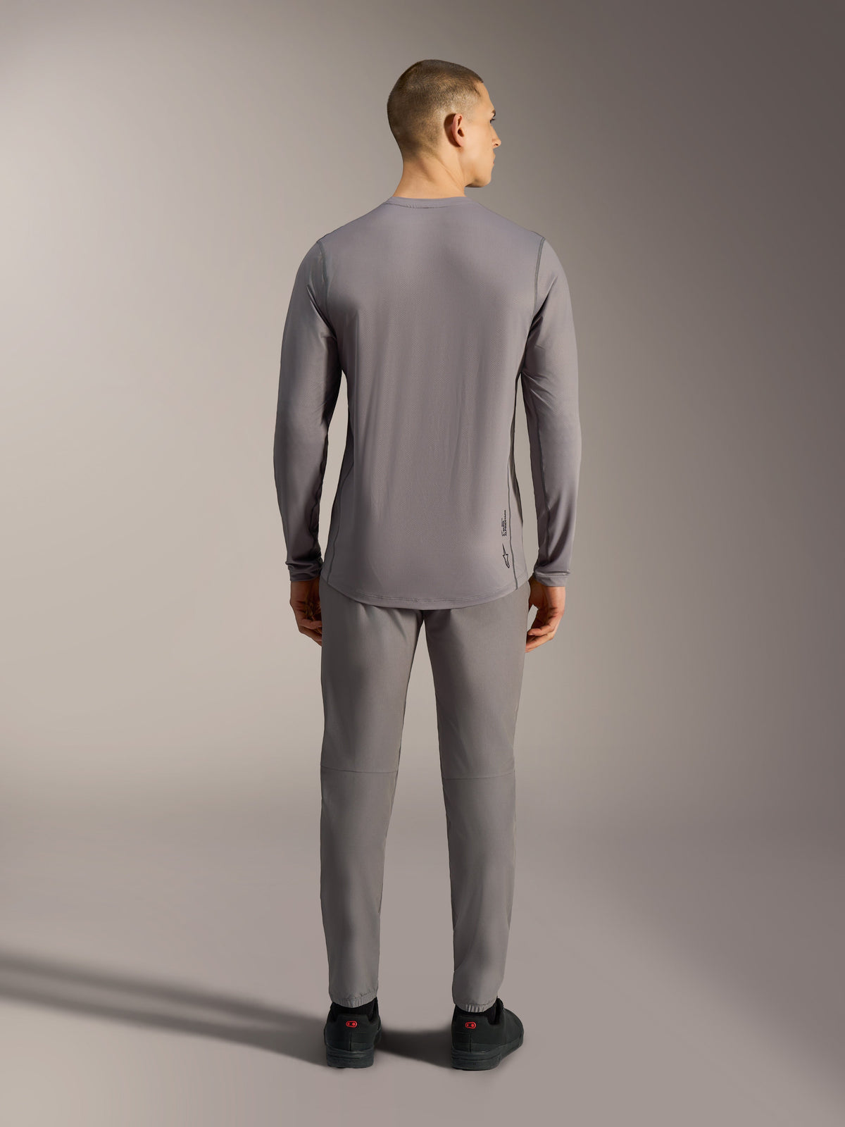 Alpinestars A-Dura Ride Long Sleeve Jersey in Gray, performance MTB top with jacquard stretch fabric and a dropped tail.