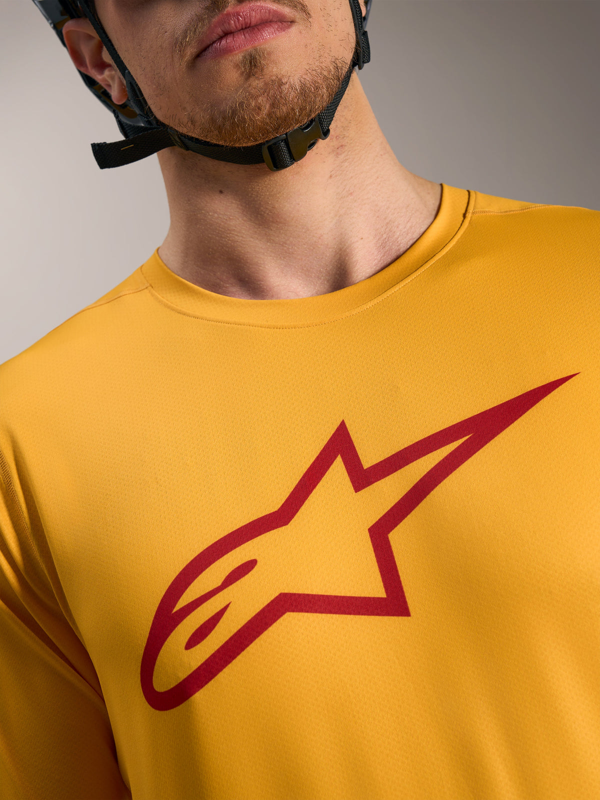 Orange A-Dura Ride Short Sleeve Jersey with a red Astars logo on the chest, lightweight MTB performance apparel.