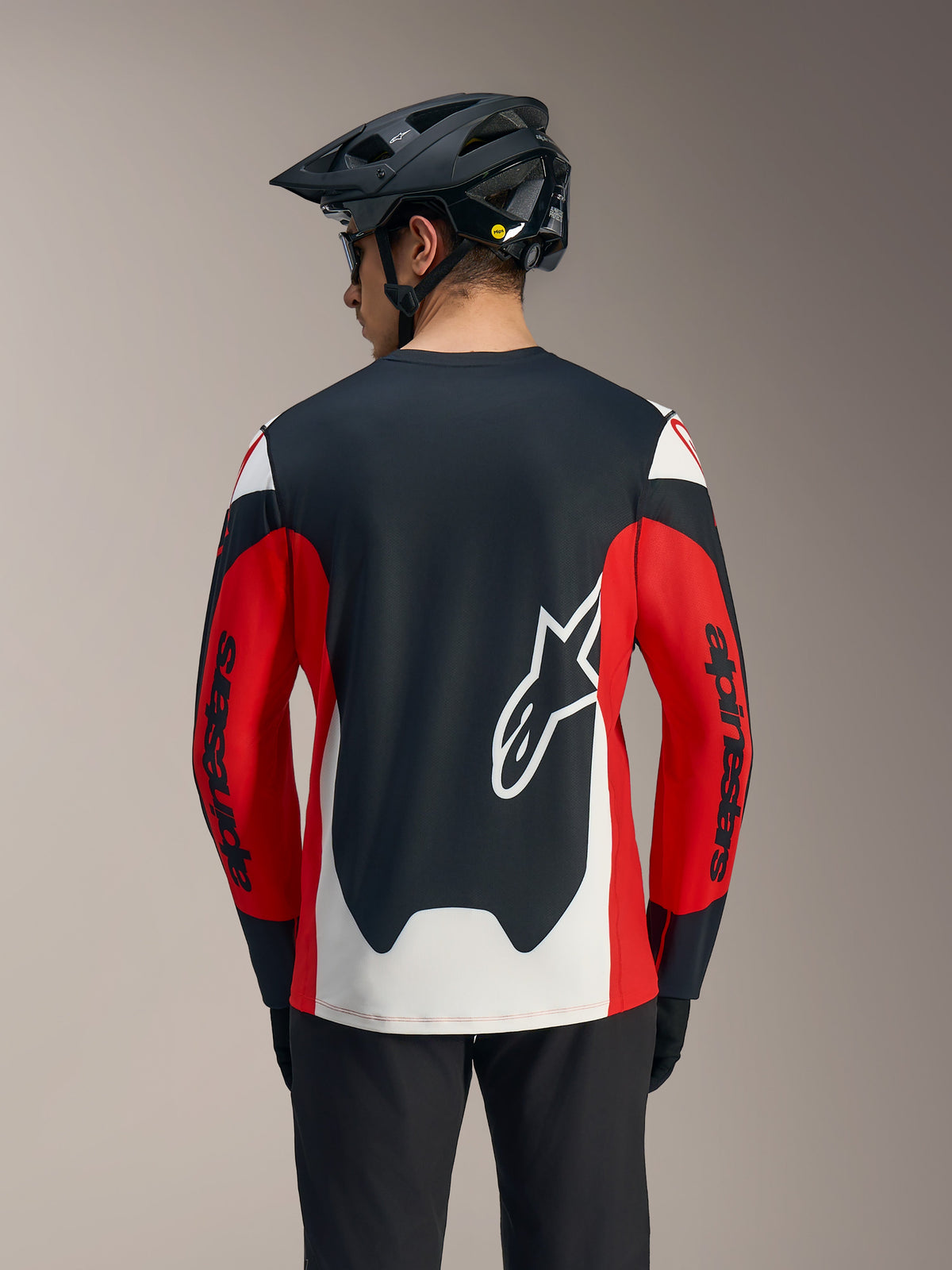A-Dura Race Long Sleeve Jersey in red, black, and white, featuring a large white Astars logo and racing graphics on the back.