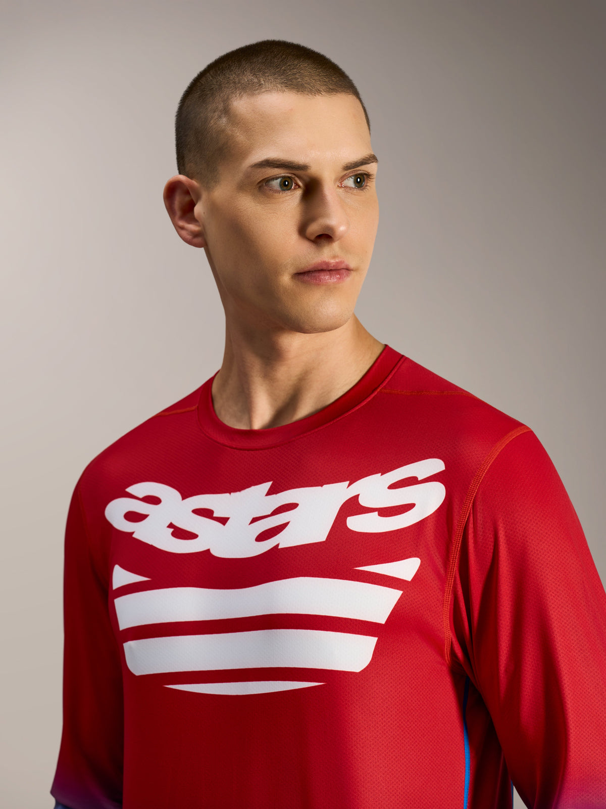 A-Dura ASTARS Jersey 2.0, long sleeve MTB jersey in bright red and blue with white logo graphics on the chest.