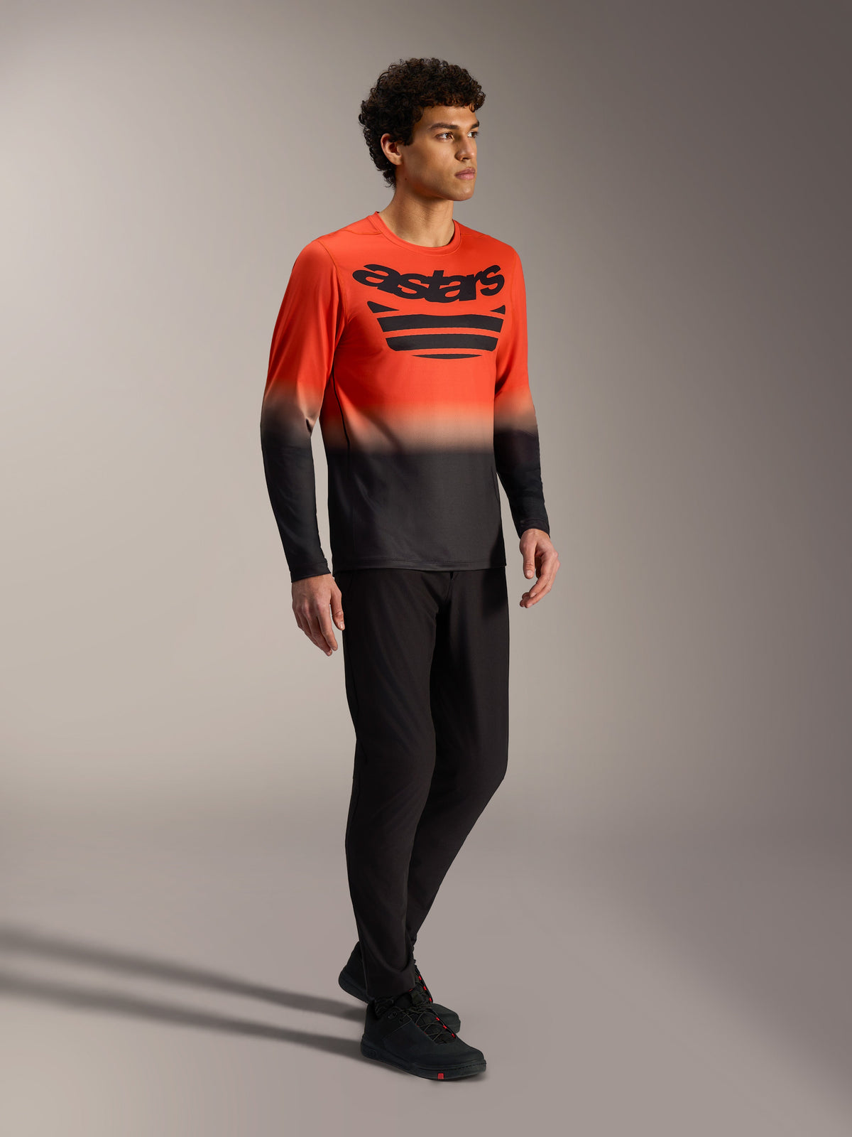 Orange and black A-Dura ASTARS Long Sleeve Jersey 2.0 with bold chest logo, designed for mountain bike performance.