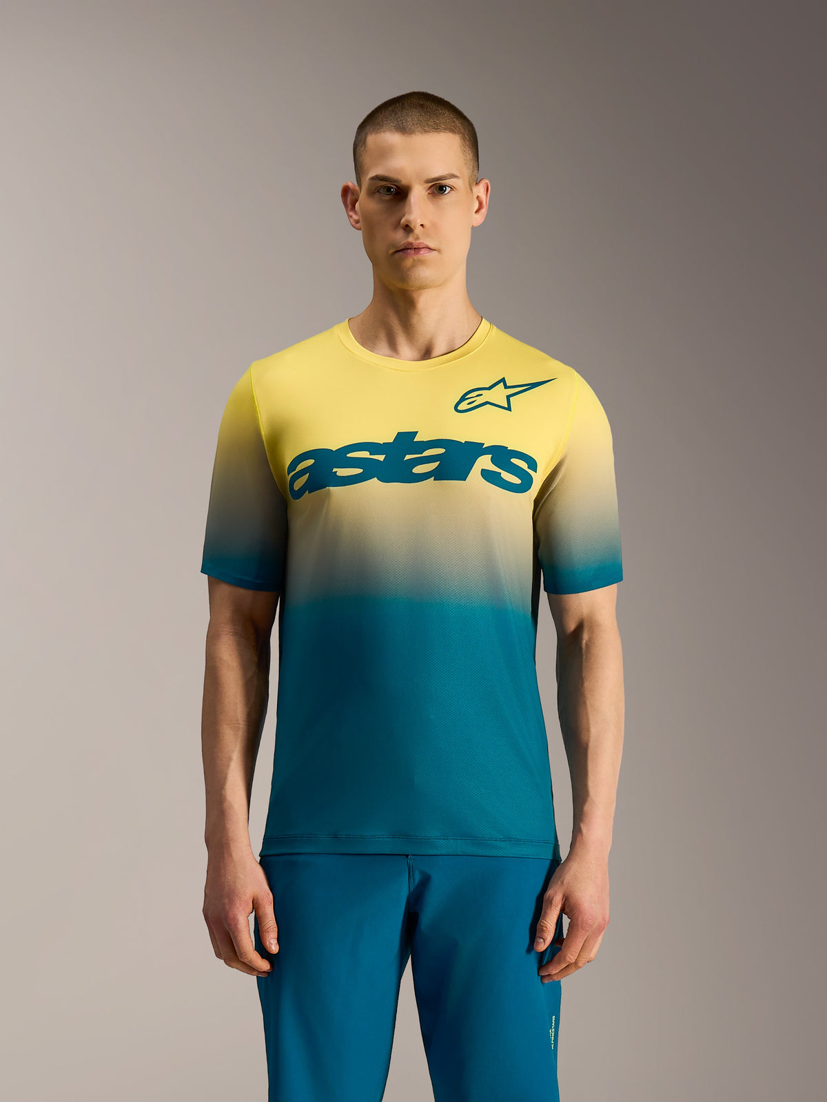 A-Dura ASTARS Jersey 2.0, short sleeve MTB top with blue green to yellow fluo gradient and bold chest logo.