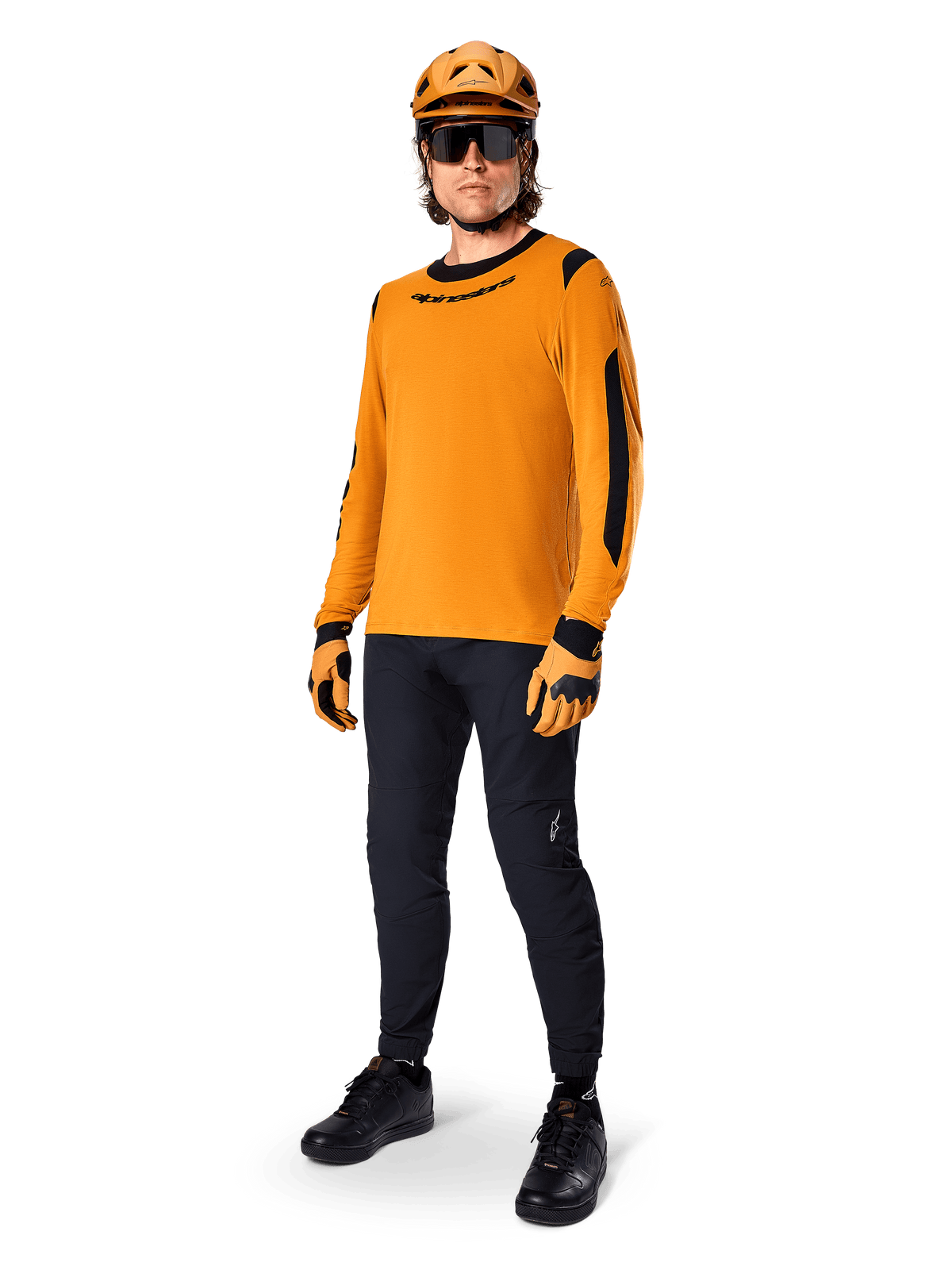 Alpinestars A-Dura Dri Wool Jersey - Long Sleeve, Dark Gold, worn with matching orange helmet, black MTB pants, and yellow and black gloves, full cycling outfit for off-road trail riding