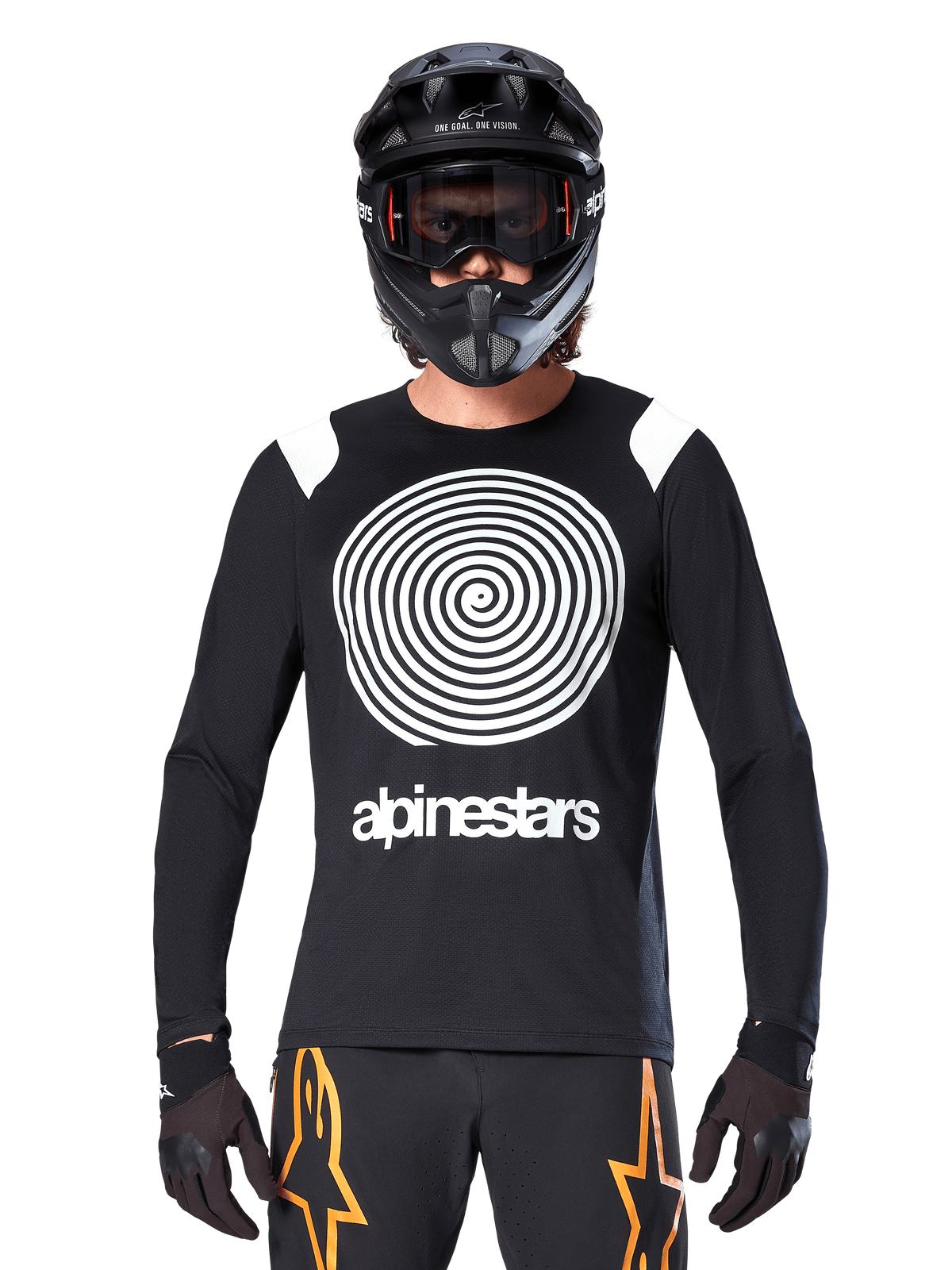 Alpinestars A-Supra Oscar Long Sleeve Jersey, Black with white spiral graphic and shoulder accents, worn by a rider with a black full-face helmet and goggles, black and orange pants, performance cycling gear for MTB gravity riding