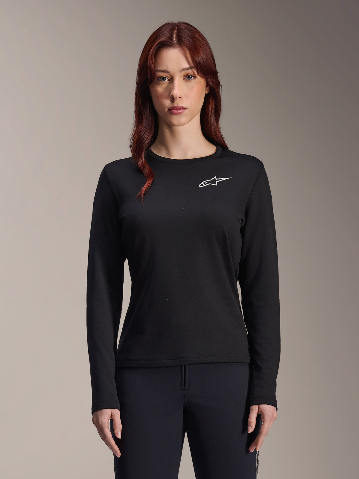 Alpinestars Stella A-Dura Thermal Jersey, Women's Long-Sleeve MTB Jersey, Black with white star logo on the chest, lightweight insulated fabric for cold weather cycling, designed for layering and trail comfort