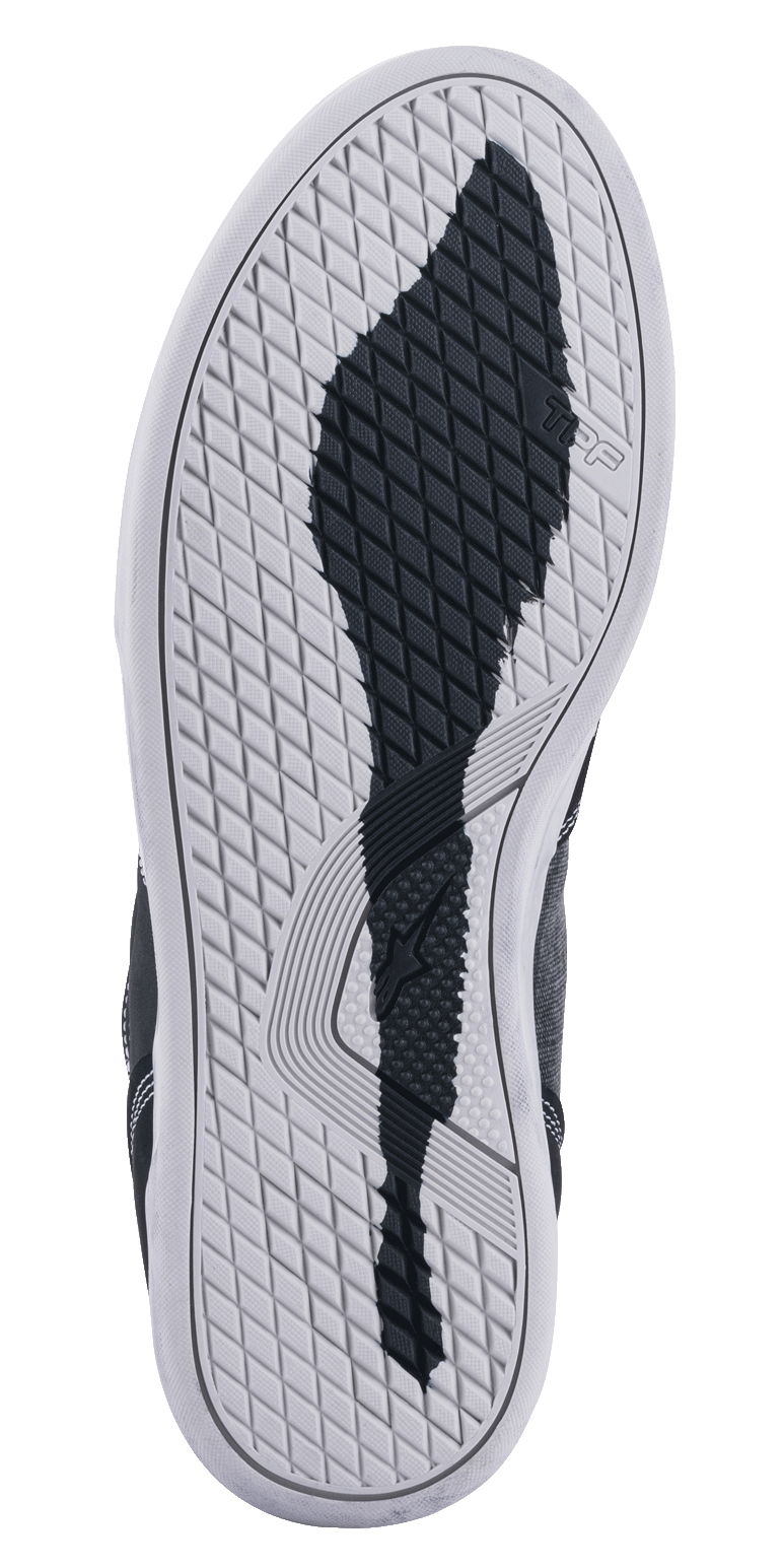 Alpinestars Ageless Riding Shoes, Bottom Sole View, White Rubber Outsole with a Black Textured Grip Pattern, featuring TPF and Alpinestars star logos, diamond-shaped tread for motorcycle urban riding