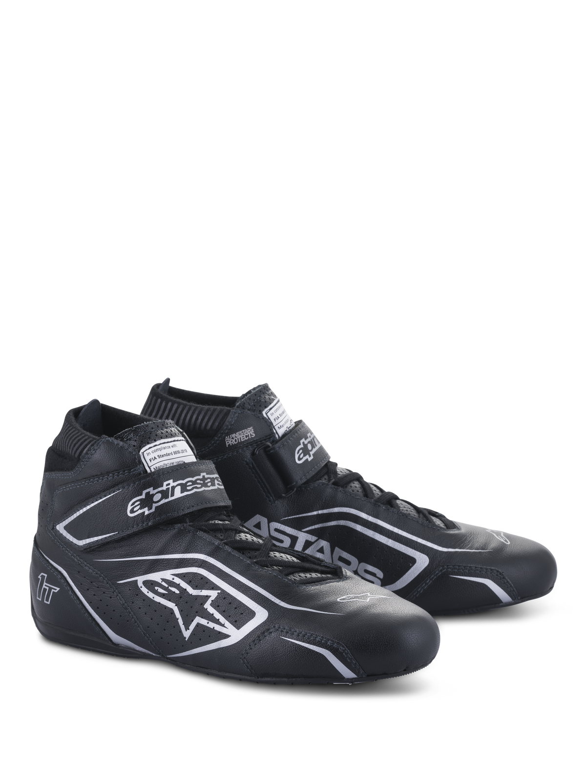 Alpinestars Tech-1 T V3 Shoes FIA, Auto Racing Shoes, Black and Silver, bovine leather construction with silver Alpinestars logos and branding, side-angled view featuring hook-and-loop strap and lace-up closure