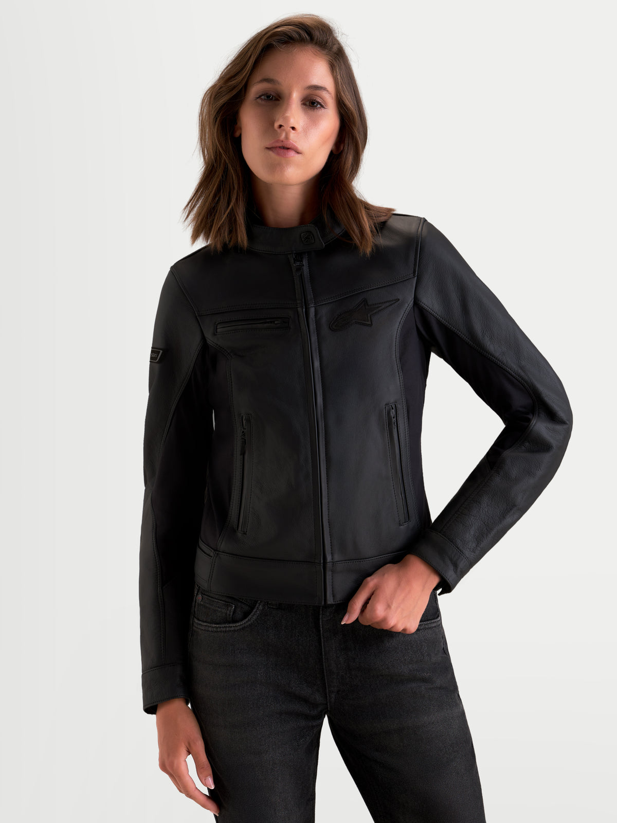 Alpinestars Stella Maver-X Leather Jacket, women's urban contemporary motorcycle jacket in black, premium bovine leather construction featuring stretch inserts and a tailored cut worn by a model.