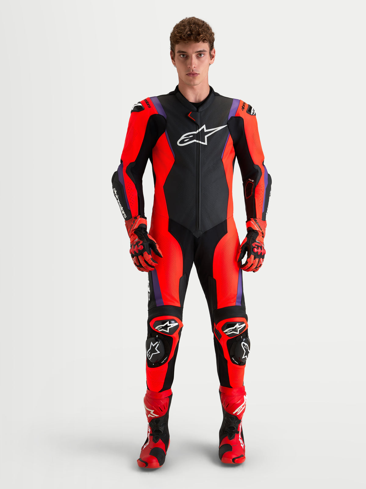 Alpinestars Missile V3 Leather Suit -1 Piece, Men's One-Piece Motorcycle Racing Suit, Black, Red, and Purple, AAA Certified with Level 2 armor and DFS protection, worn by a model