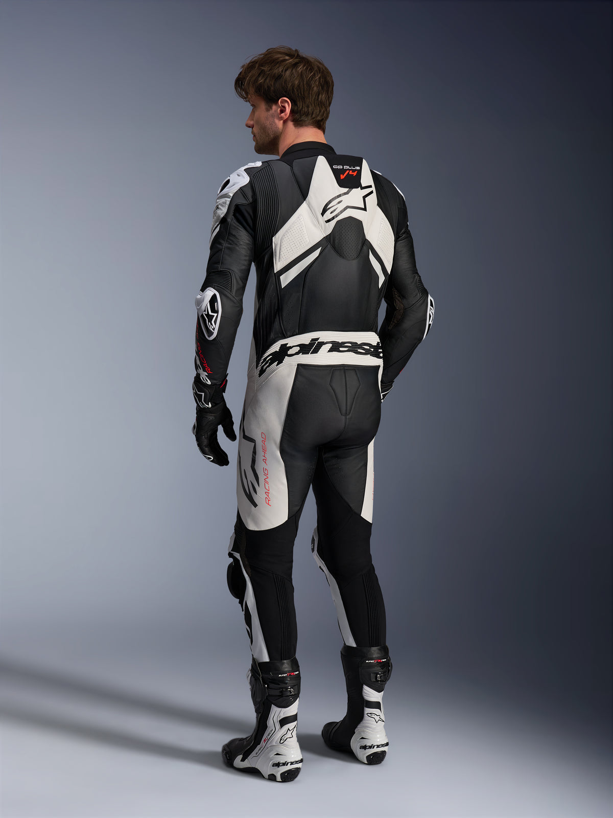 Alpinestars GP Plus V4 Sprint 1PC Leather Suit, Black and White, rear view with racing aero hump, men's motorcycle gear.