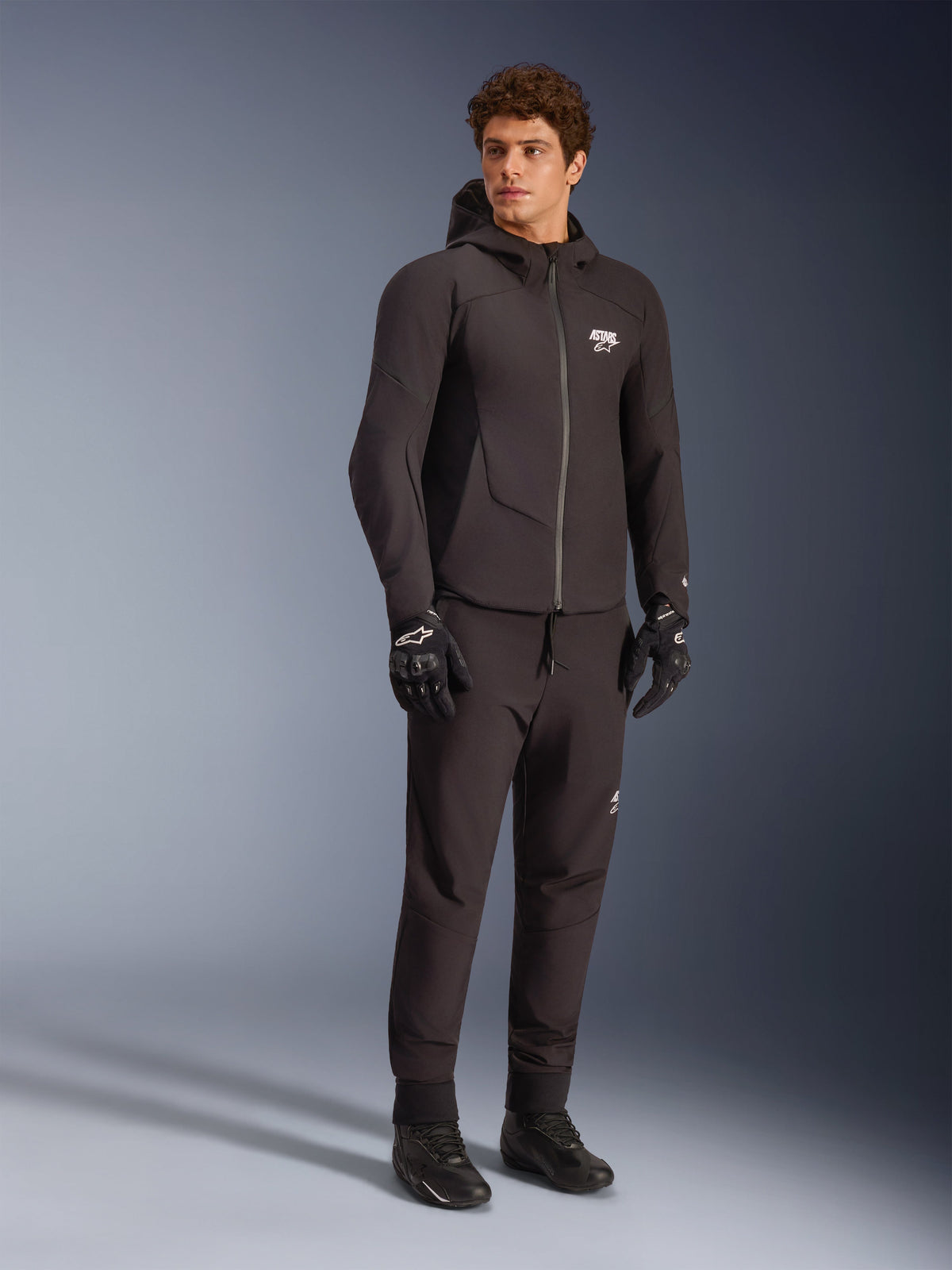 Alpinestars Aeroshell Waterproof Jacket in black, men's textile softshell hoodie for sport-naked road riding.