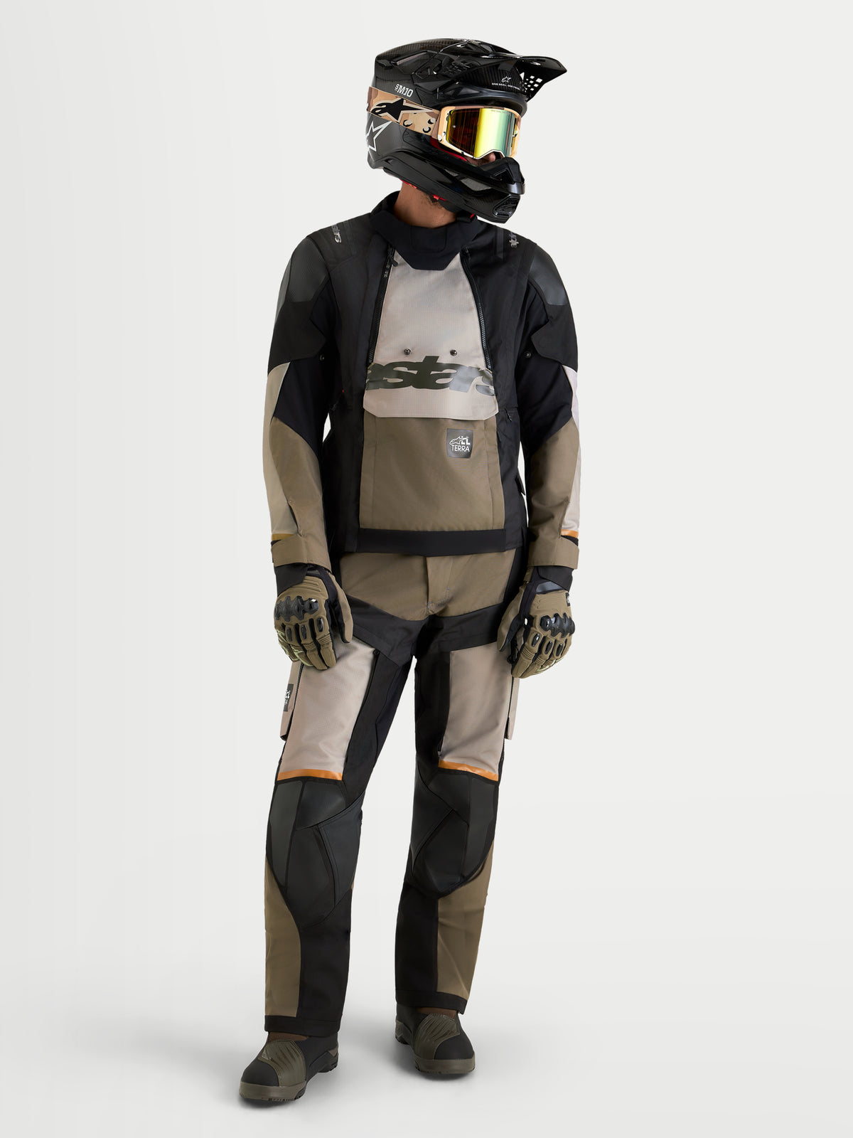 Alpinestars Harok V2 Drystar Jacket, Men's Adventure Motorcycle Jacket, Aluminum, Walnut, and Black, worn with matching riding pants, helmet, goggles, and gloves for all-terrain touring