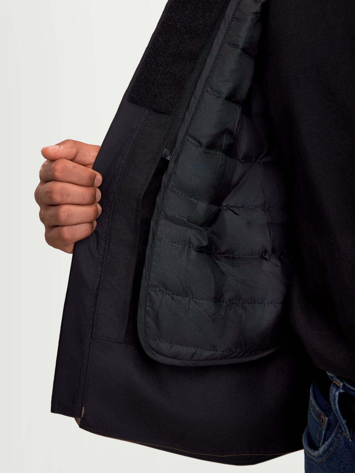 Alpinestars C-1 Waterproof Jacket, men's urban motorcycle textile jacket in walnut black, close-up detail showing the inner detachable thermal vest and welded padding construction