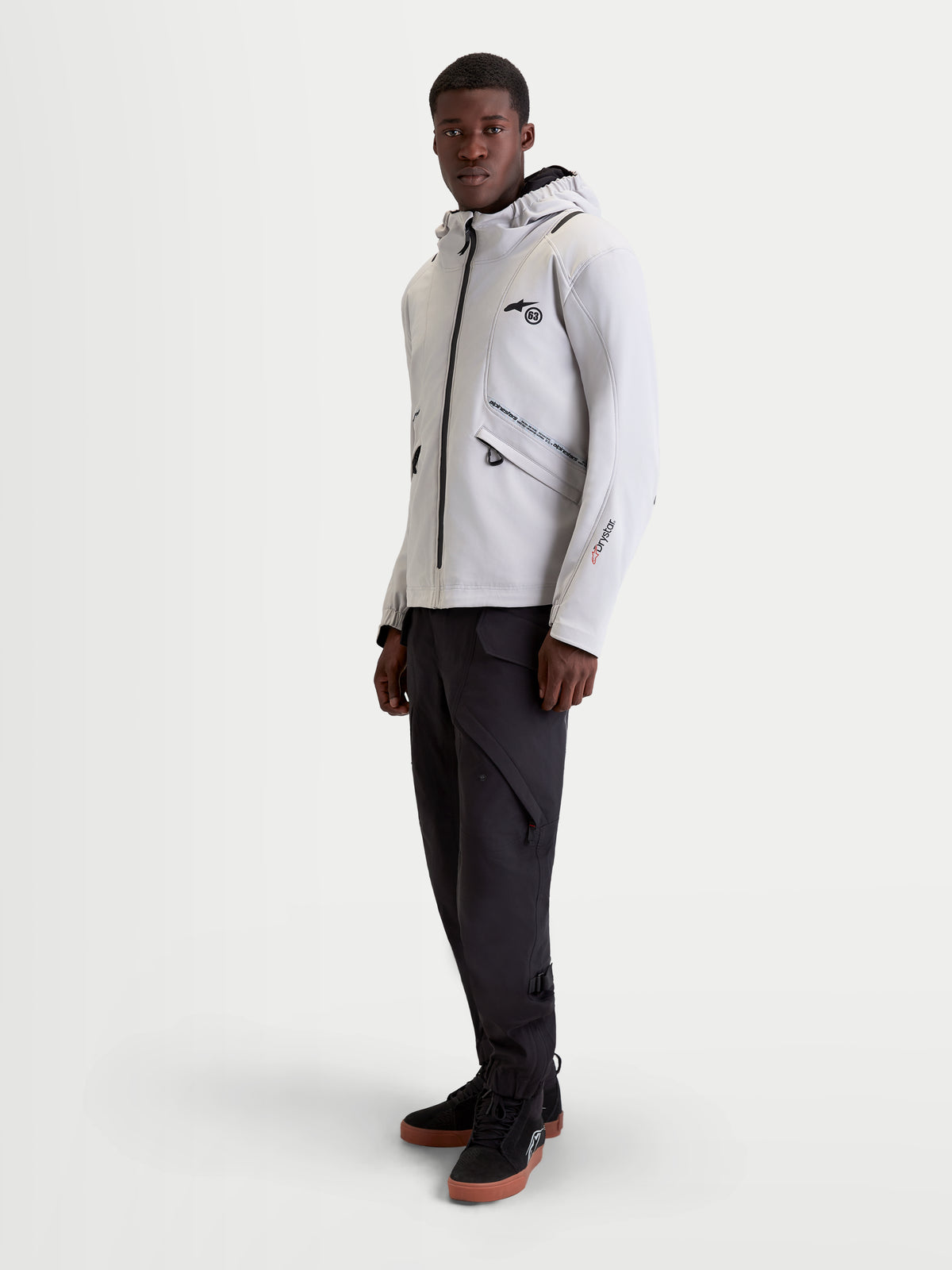 Alpinestars C-5 Drystar Jacket, men's urban contemporary motorcycle textile jacket in light gray and black, worn by a model showcasing the waterproof softshell construction, integrated hood, and protective features.
