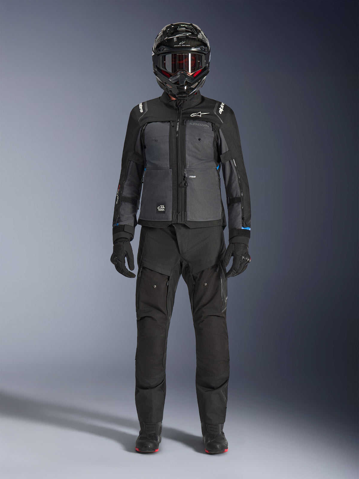 Alpinestars Cusco Drystar® Jacket, Black and Deep Gray adventure touring jacket, worn with matching black pants, gloves, and a full-face helmet, front full-body view, protective motorcycle apparel