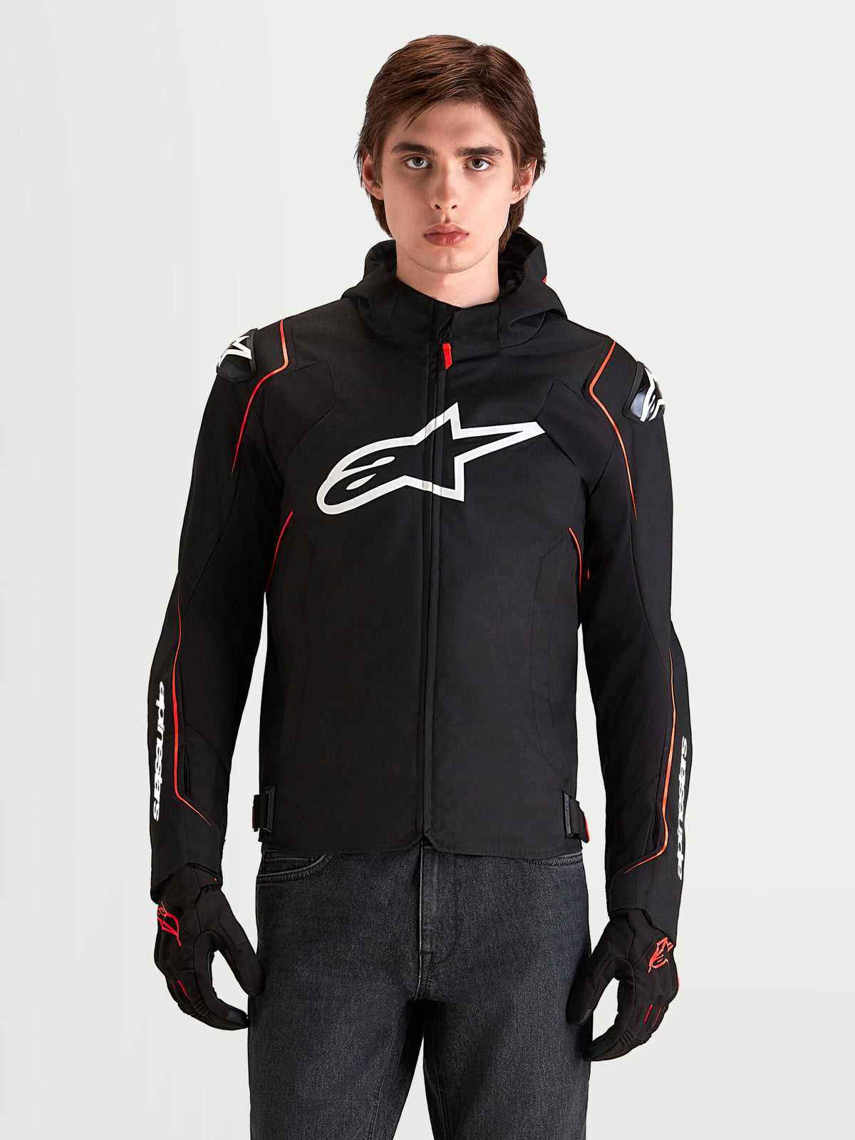 Alpinestars Zaca V2 Waterproof Jacket, Men's motorcycle sport jacket in Black and Red Fluo, featuring DFS shoulder armor and a white Astar logo on the chest, worn by a model in an on-model studio shot