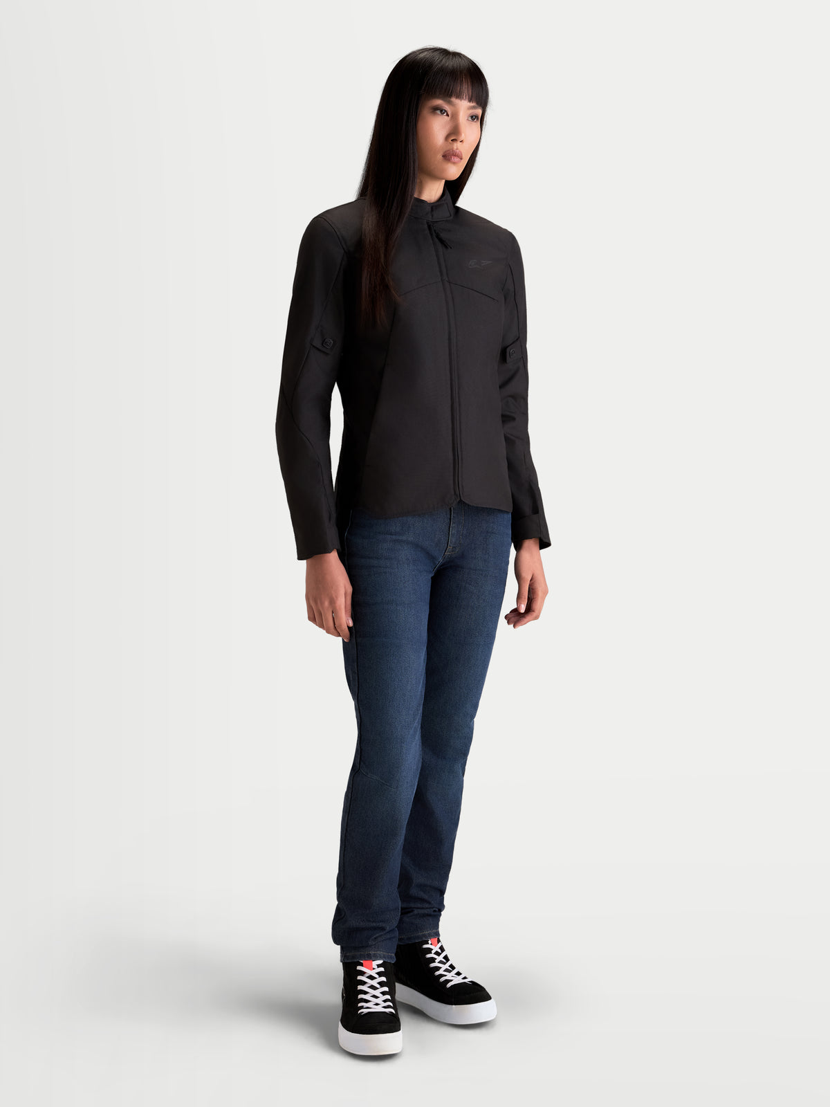 Alpinestars Stella C-1 Waterproof Jacket, women's urban motorcycle textile jacket in black, front view on a model wearing casual riding gear