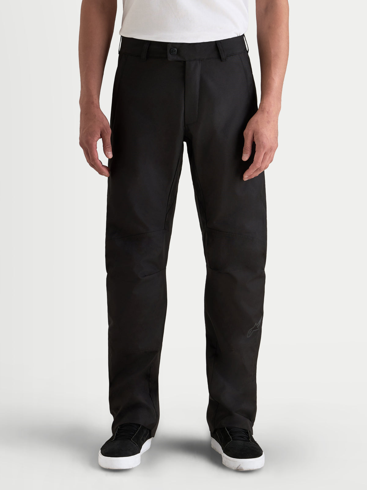 Alpinestars C-1 Waterproof Pants, men's urban contemporary motorcycle riding pants in black, front view on a model wearing a white t-shirt, featuring a durable polyfabric shell and straight-fit design.