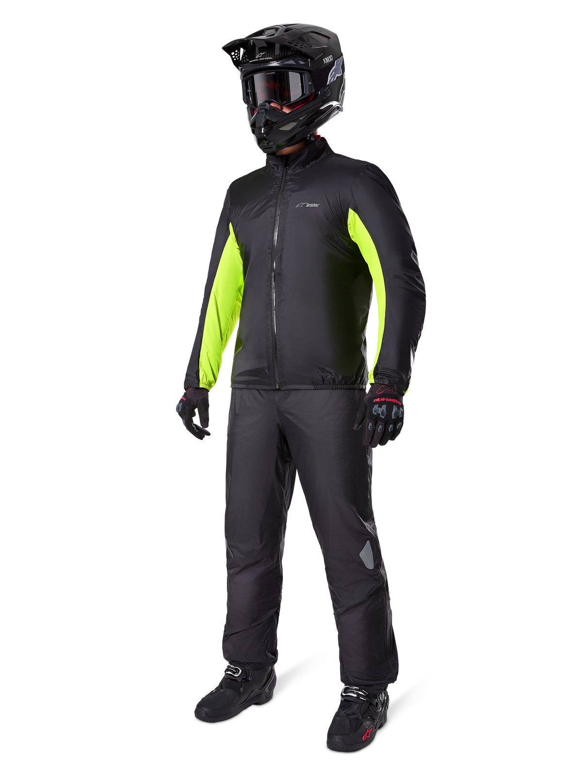 Alpinestars Bogota' Pro Drystar® 3 Seasons Pants, Black, rider wearing full adventure touring gear including a black jacket with neon yellow accents, black helmet, gloves, and boots, featuring the waterproof Drystar® membrane worn over the pants