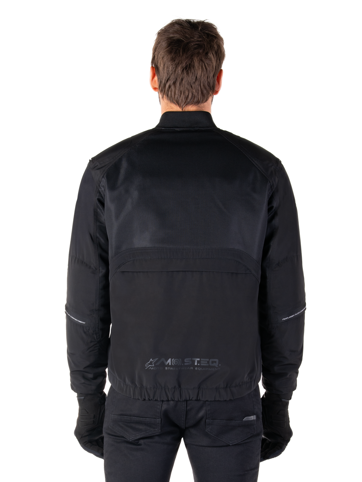 Alpinestars Mootant Waterproof Parka, Black Motorcycle Jacket, Rear view showing mesh upper for airflow and MO.ST.EQ. reflective logo on the lower back, modular 4-season gear
