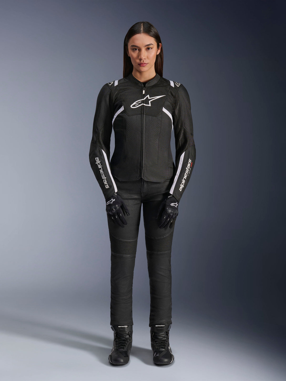 Alpinestars Stella T-Sps Air V2 Jacket, Women's Motorcycle Jacket, Black and White, featuring mesh panels and white accents, worn with black pants, gloves, and boots, athletic fit for urban riding