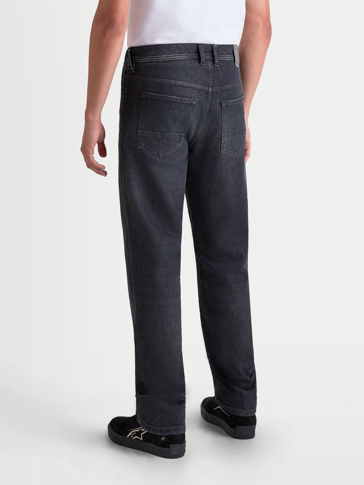Alpinestars Flex-AST 8 Denim Pants Short, men's urban motorcycle riding jeans in used black, rear view showing single-layer technical denim construction and five-pocket layout worn by a model.