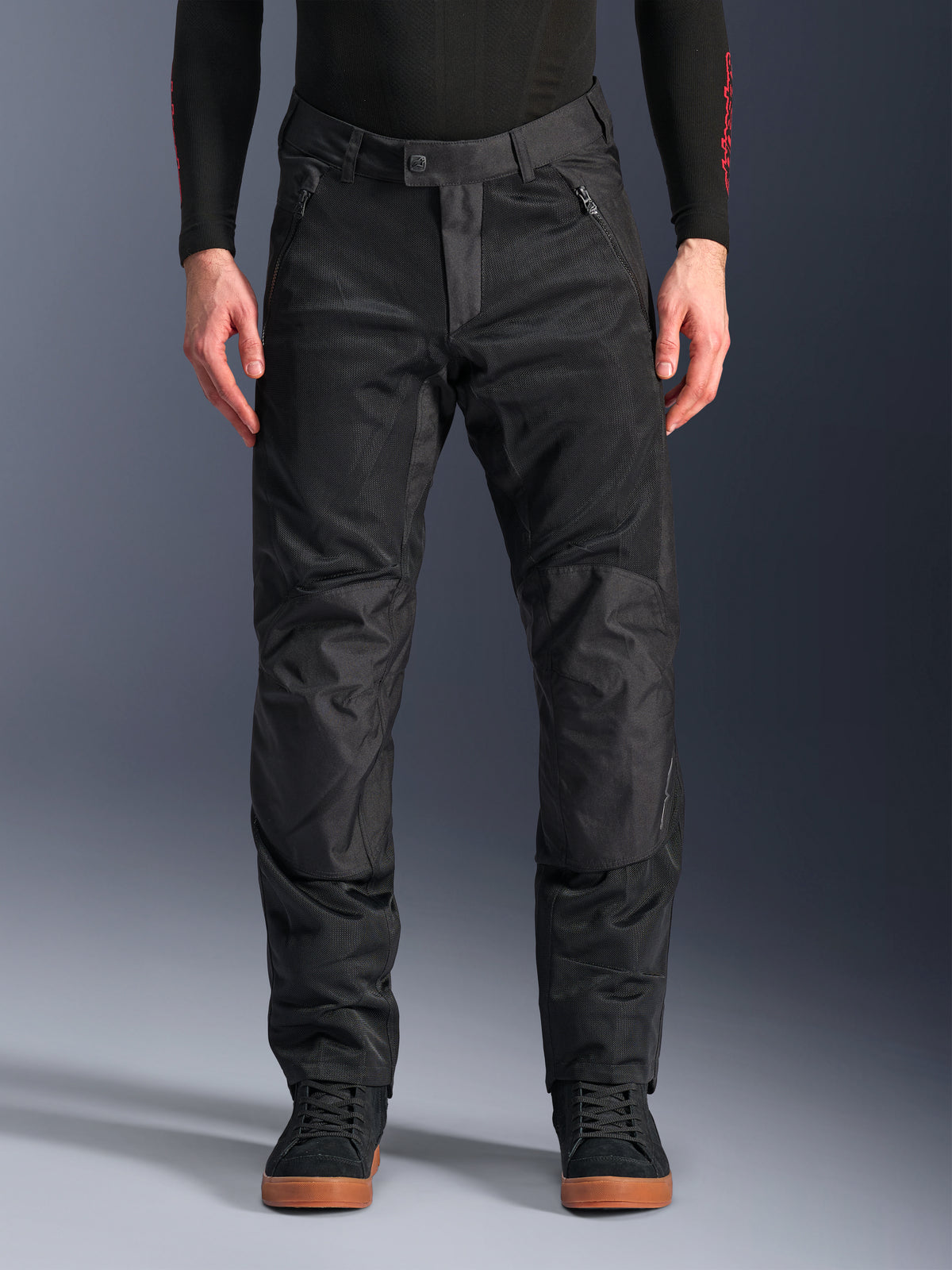 Alpinestars C-1 Air Pants, Black Textile Motorcycle Pants, urban riding gear featuring extensive mesh panels for airflow, reinforced knee sections, zippered front pockets, and a clean tailored fit.