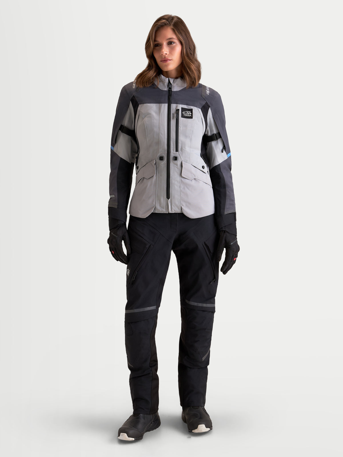 Alpinestars Stella St-7 V2 2L Gore-Tex® Jacket, women's adventure touring motorcycle jacket in mid gray, deep gray, and black, front full-body view worn by a model featuring waterproof textile construction and matching pants.