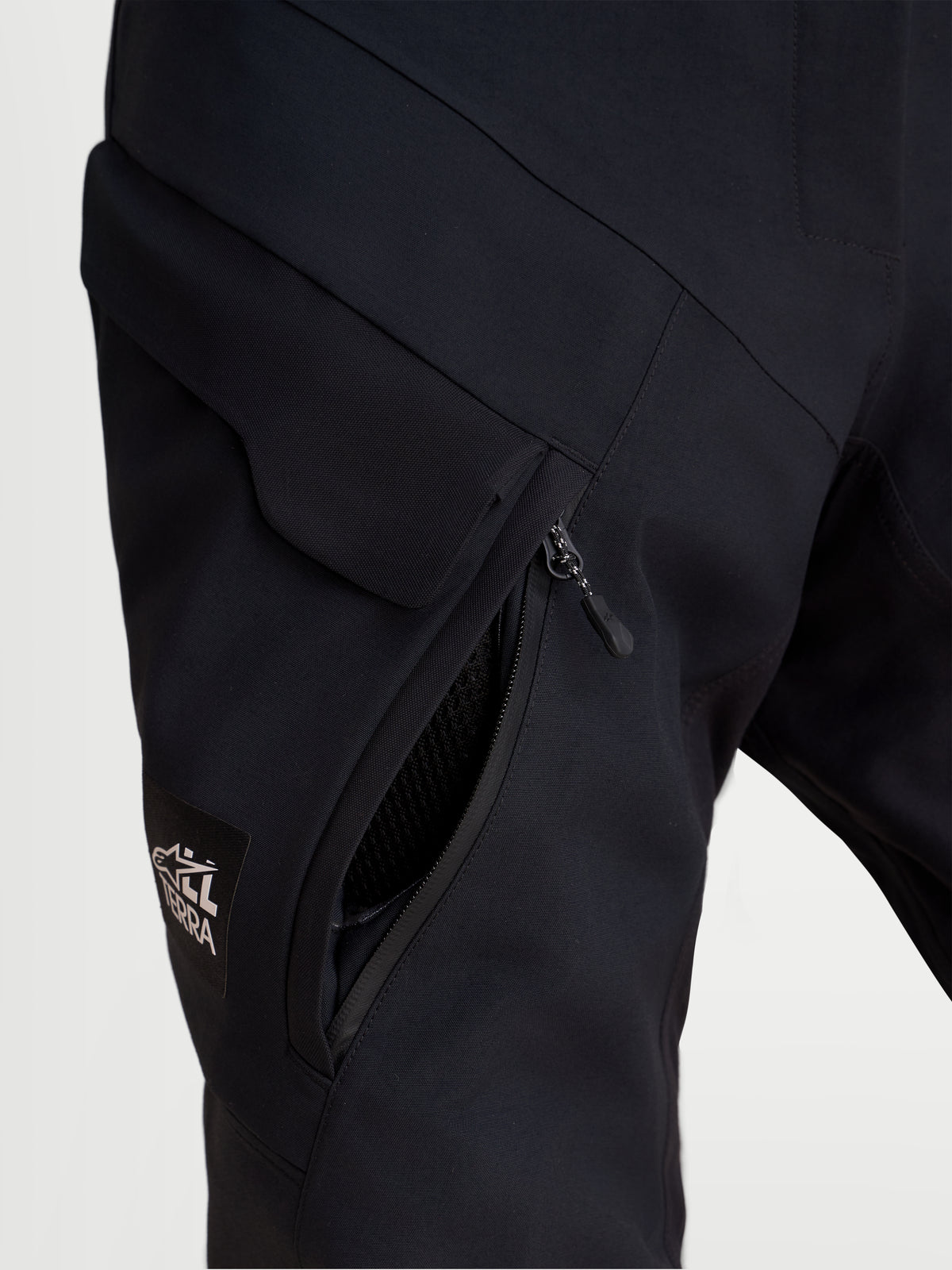 Alpinestars Stella ST-7 V2 2L Gore-Tex Pants, women's adventure touring motorcycle pants, black, close-up view showing waterproof cargo pocket and thigh ventilation zipper