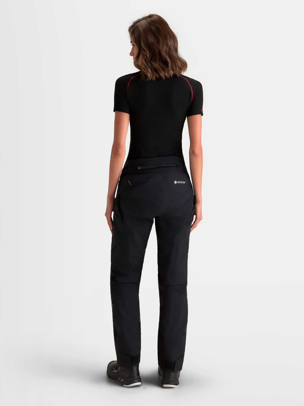 Alpinestars Stella ST-7 V2 2L Gore-Tex Pants Short, women's adventure touring motorcycle pants in black, rear profile view worn by a model, featuring waterproof GORE-TEX construction and AA certified protection.