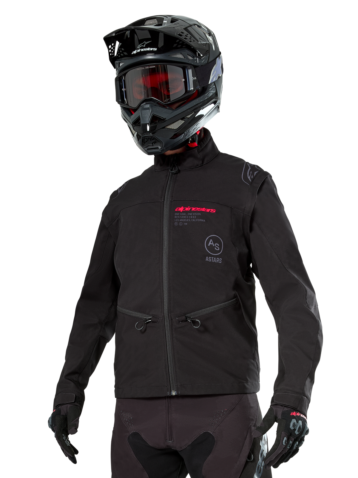 Alpinestars Lite-Dura Softshell Jacket, Black off-road motorcycle jacket with red branding and AS logo, worn with a black motocross helmet, red goggles, and black gloves, featuring zippered hand pockets and adjustable cuffs, designed for enduro riding.