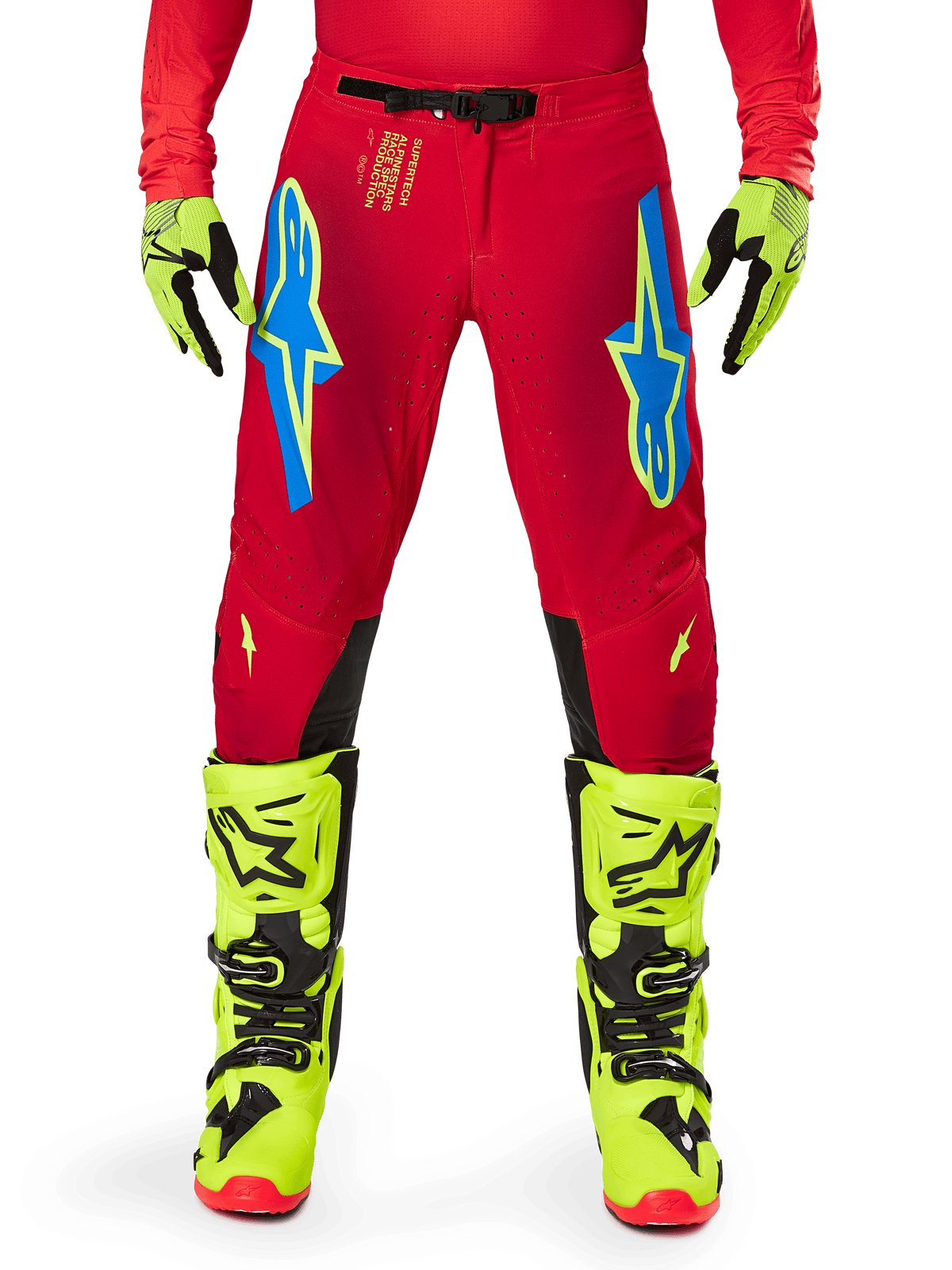 Alpinestars 2025 Supertech Maker Pants, Motocross Pants, Bright Red Yellow Fluo, worn with matching fluo yellow gloves and boots, featuring blue and fluo yellow Astars logos, black inner knee panels, and athletic design for off-road racing