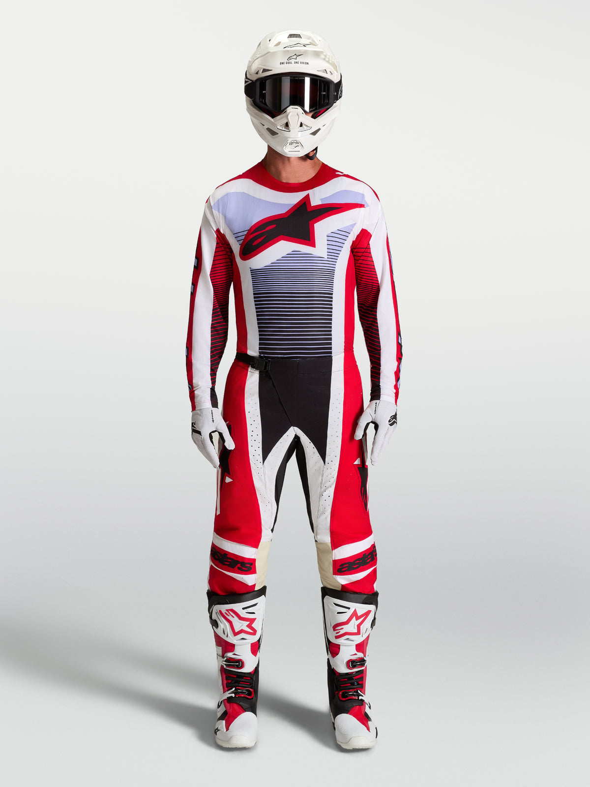 Alpinestars Techstar Maven Pants and motocross gear set in fire red and white with lavender accents and matching boots.