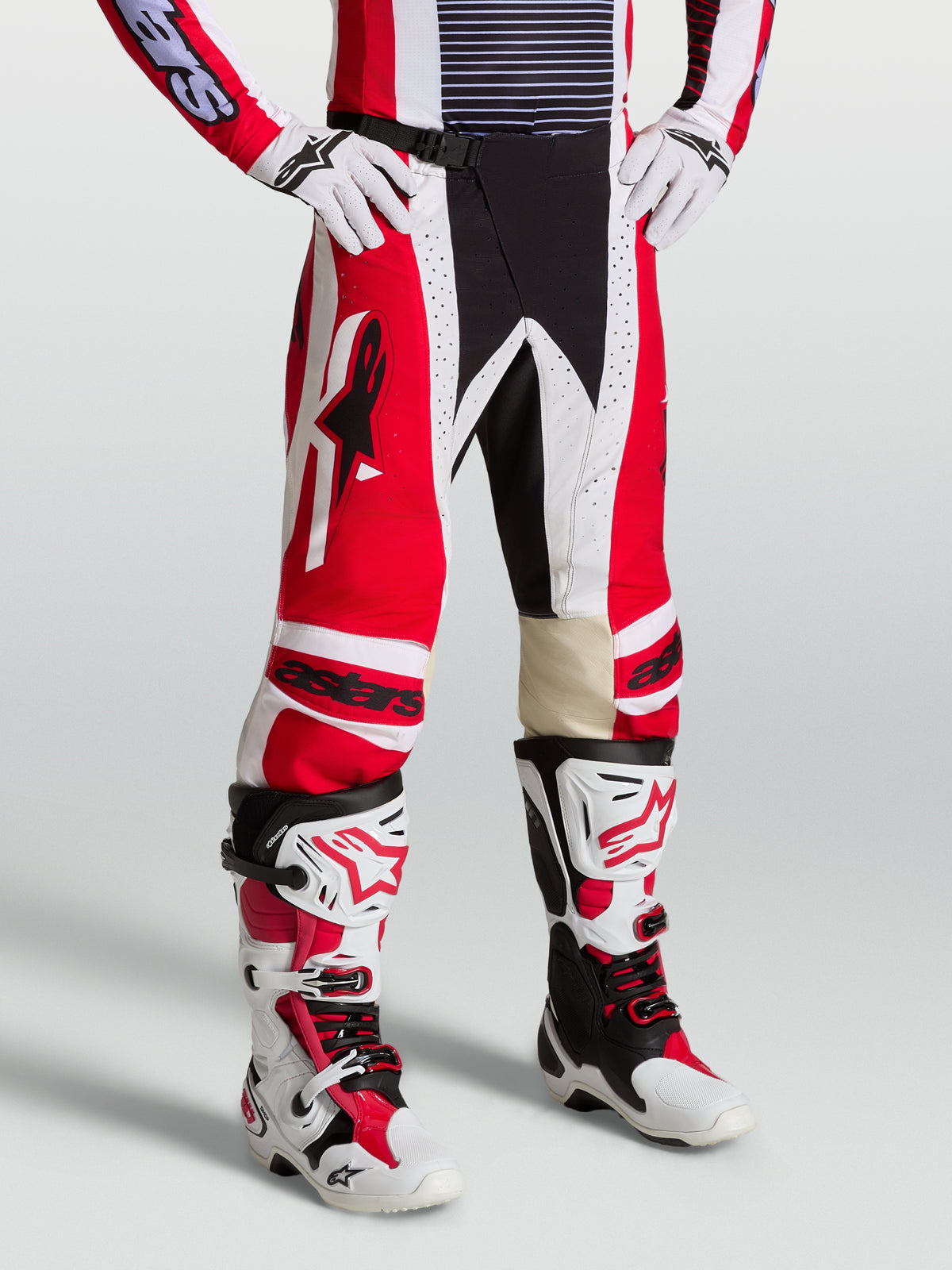 Alpinestars Techstar Maven Pants, men's red and white motocross gear with leather knee panels and athletic race fit.