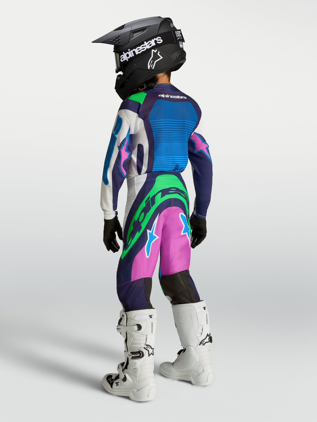 Alpinestars Youth Supertech Maven Pants, blue, pink, and green motocross gear, performance fit for young racing enthusiasts.