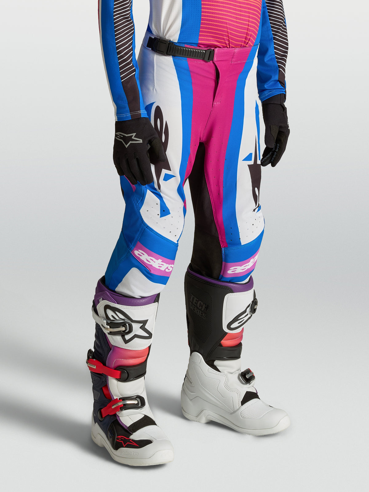 Alpinestars Youth Supertech Maven Pants in blithe blue and hot coral, designed for competitive motocross racing.