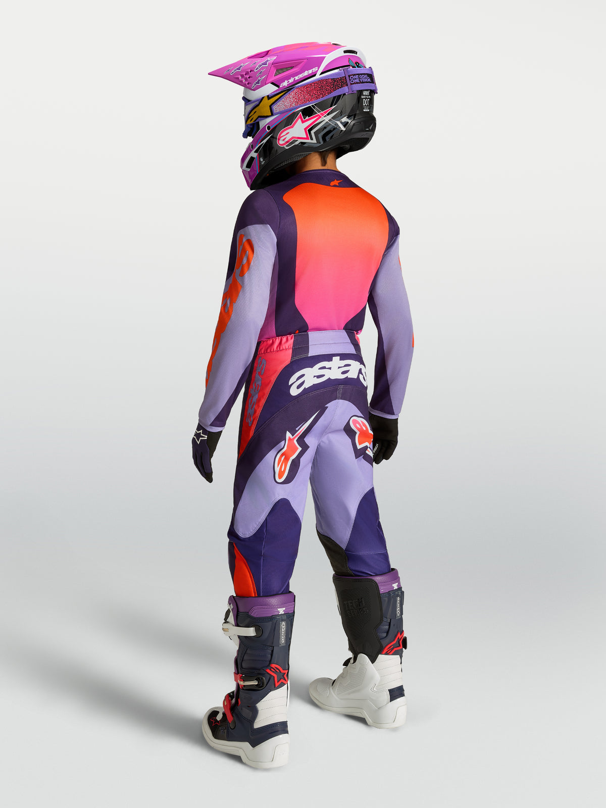 Alpinestars Youth Fluid Hunt Pants, purple and pink fluo motocross gear, durable 600D polyfabric, shown on-model back view.