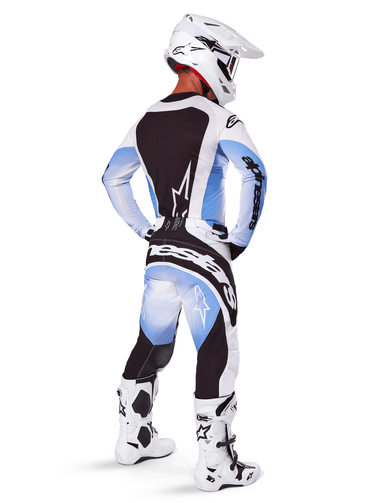Motocross rider wearing complete racing gear, 2025 Techstar Melt Gear Set, White and Light Blue jersey with black back panel, matching pants with blue gradient and black accents, white helmet, white and black boots, coordinated outfit for off-road racing