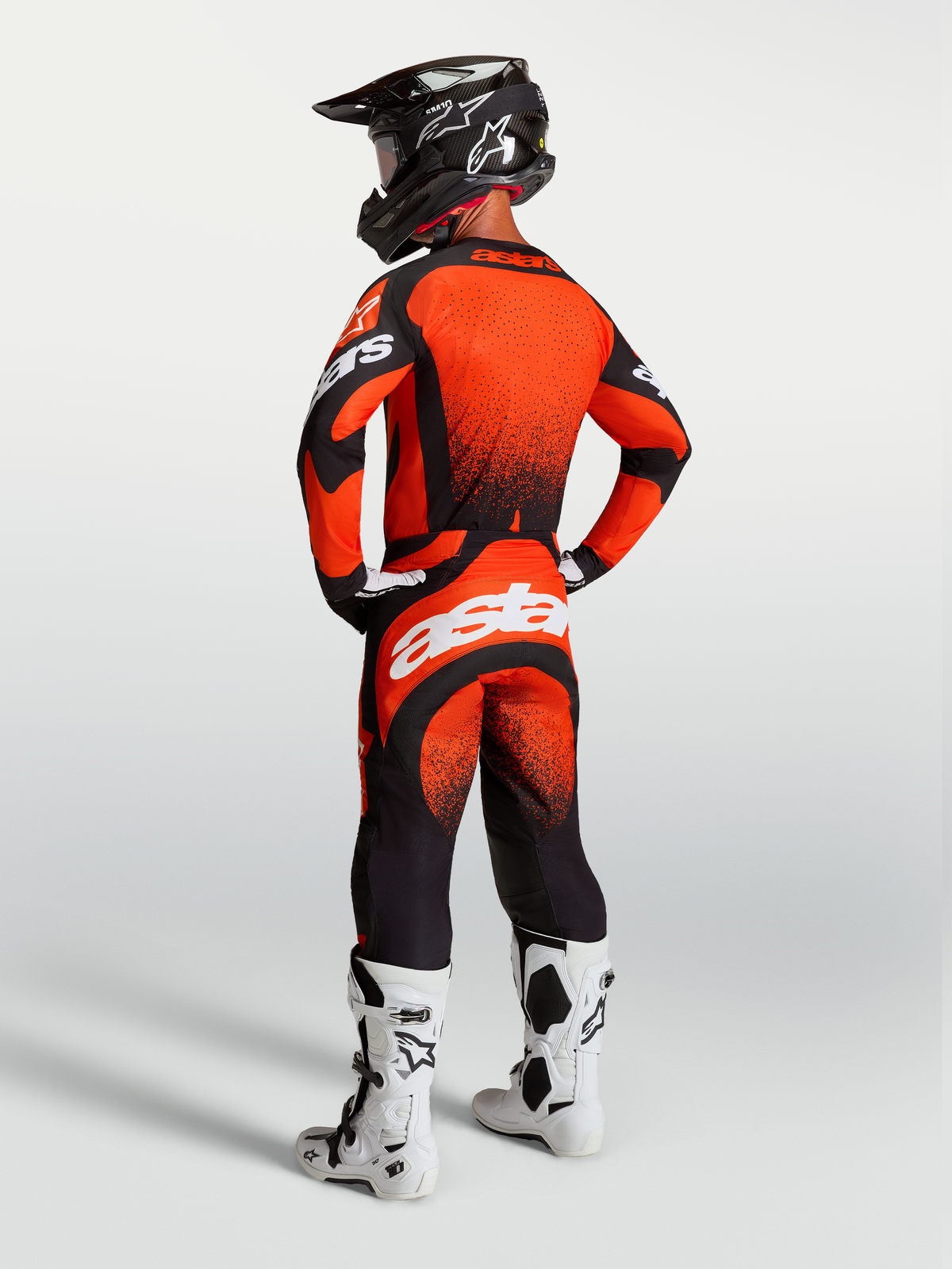 Alpinestars Techstar Swan Jersey and Gear Set, Men's Motocross Outfit, Red and Black, viewed from the back.