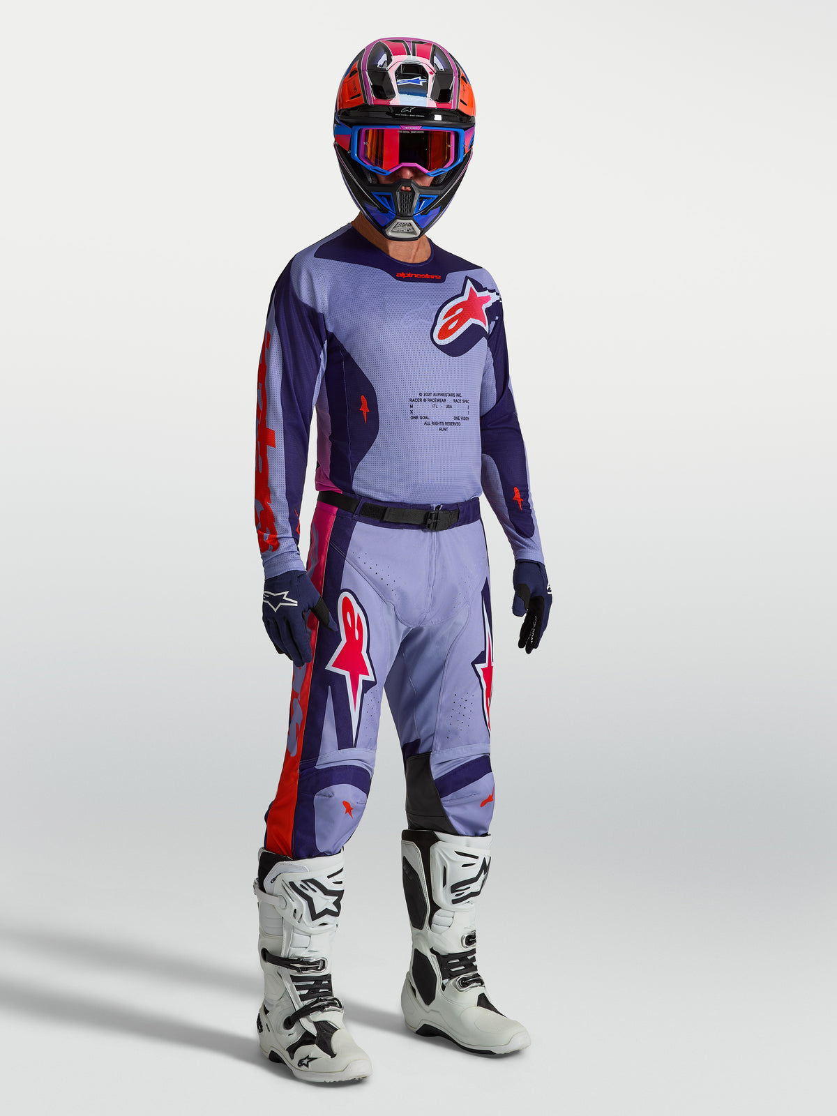 Alpinestars Racer Air Hunt Jersey, ventilated motocross top for men, purple and pink mesh, on model with full kit.