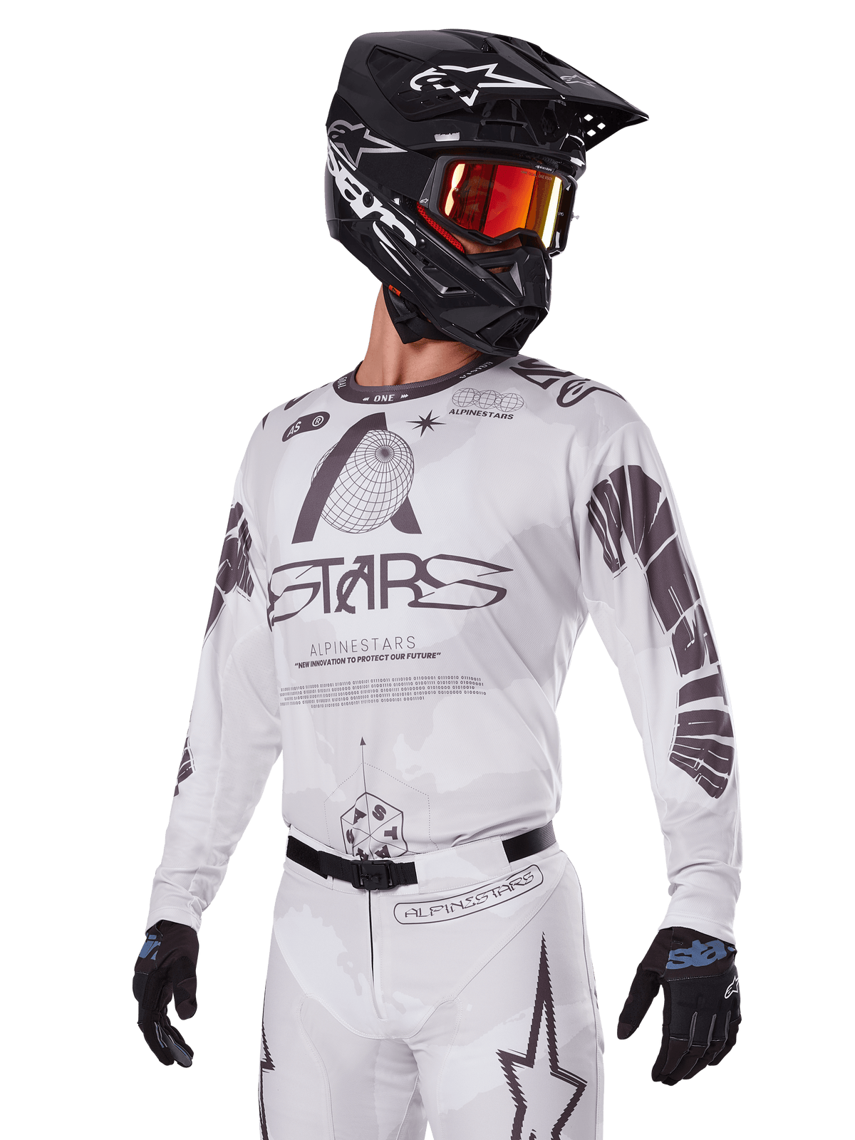 Alpinestars 2025 Racer Hollow Gear Set, Motocross Jersey and Pants, White with black and grey graphics, featuring 'ASTARS' branding and hollow globe designs, worn with a black helmet, red mirrored goggles, and black gloves, designed for off-road performance