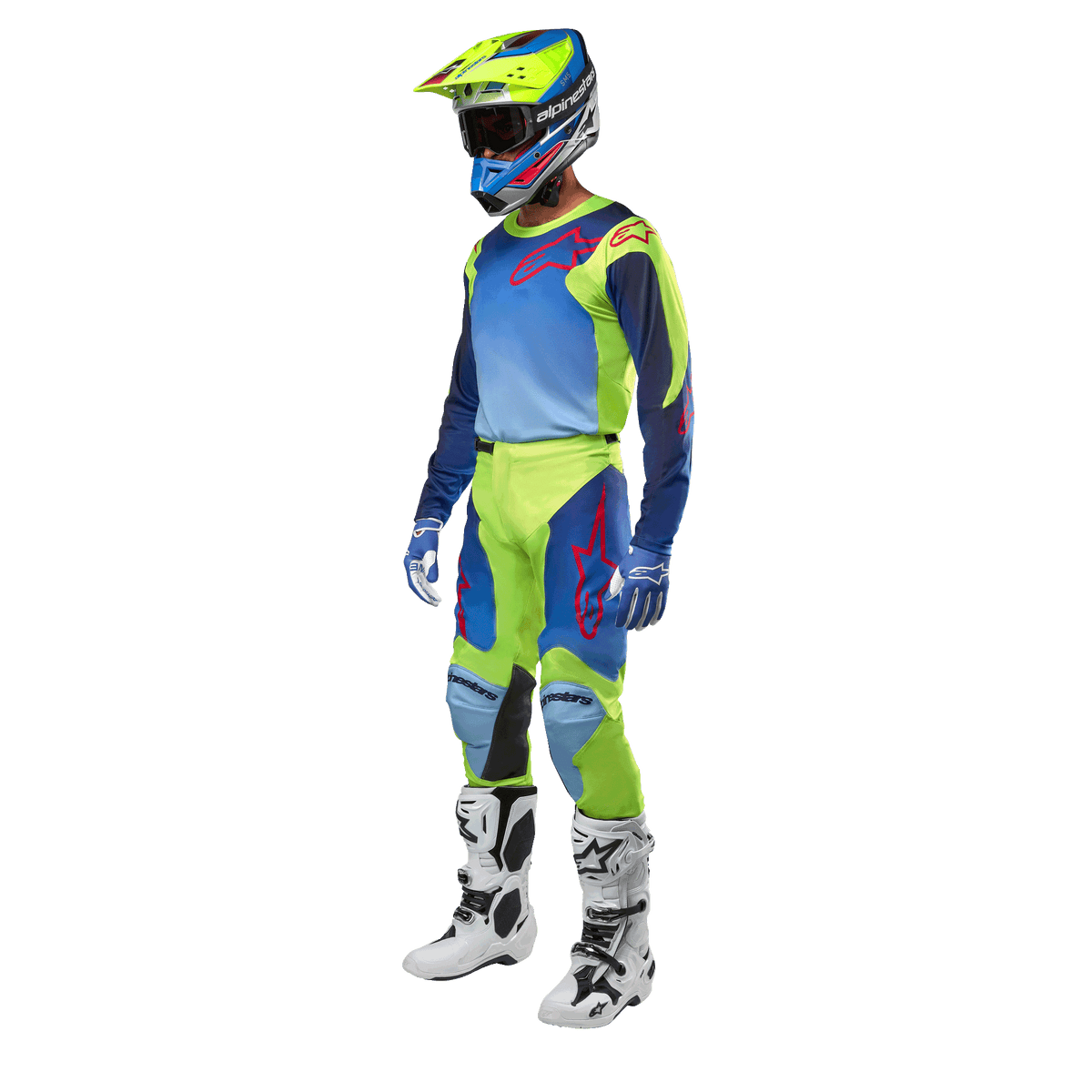 Alpinestars 2024 Racer Hoen Jersey, Motocross Jersey, Yellow Fluo and Blue Night Navy, worn by a rider with matching pants, helmet, and white boots, professional racing gear for off-road riding