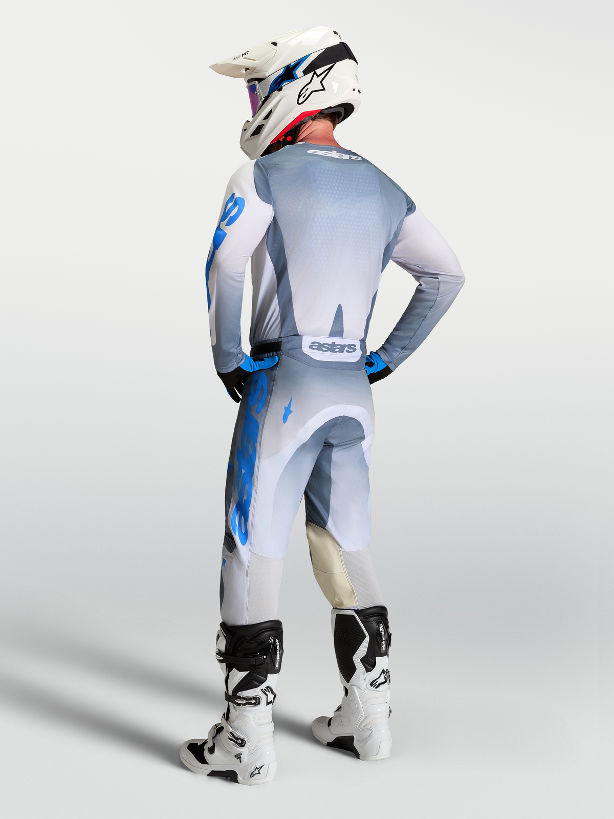 Alpinestars 2027 Racer Amber Jersey, Men's Motocross Gear, Ash Gray and UCLA Blue, rear view on rider with matching pants.